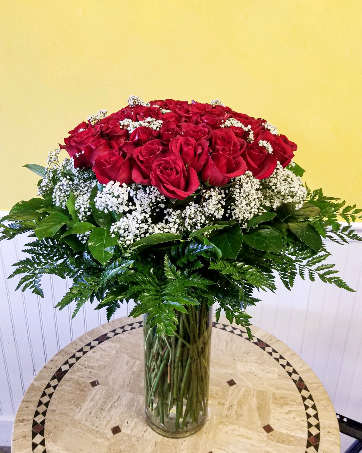 Grand Amour Bouquet - Have a Special Occasion coming up? Send this  arrangement of 50 long stem roses in a large clear glass cylinder.  An absolutely stunning way  to show your appreciation .