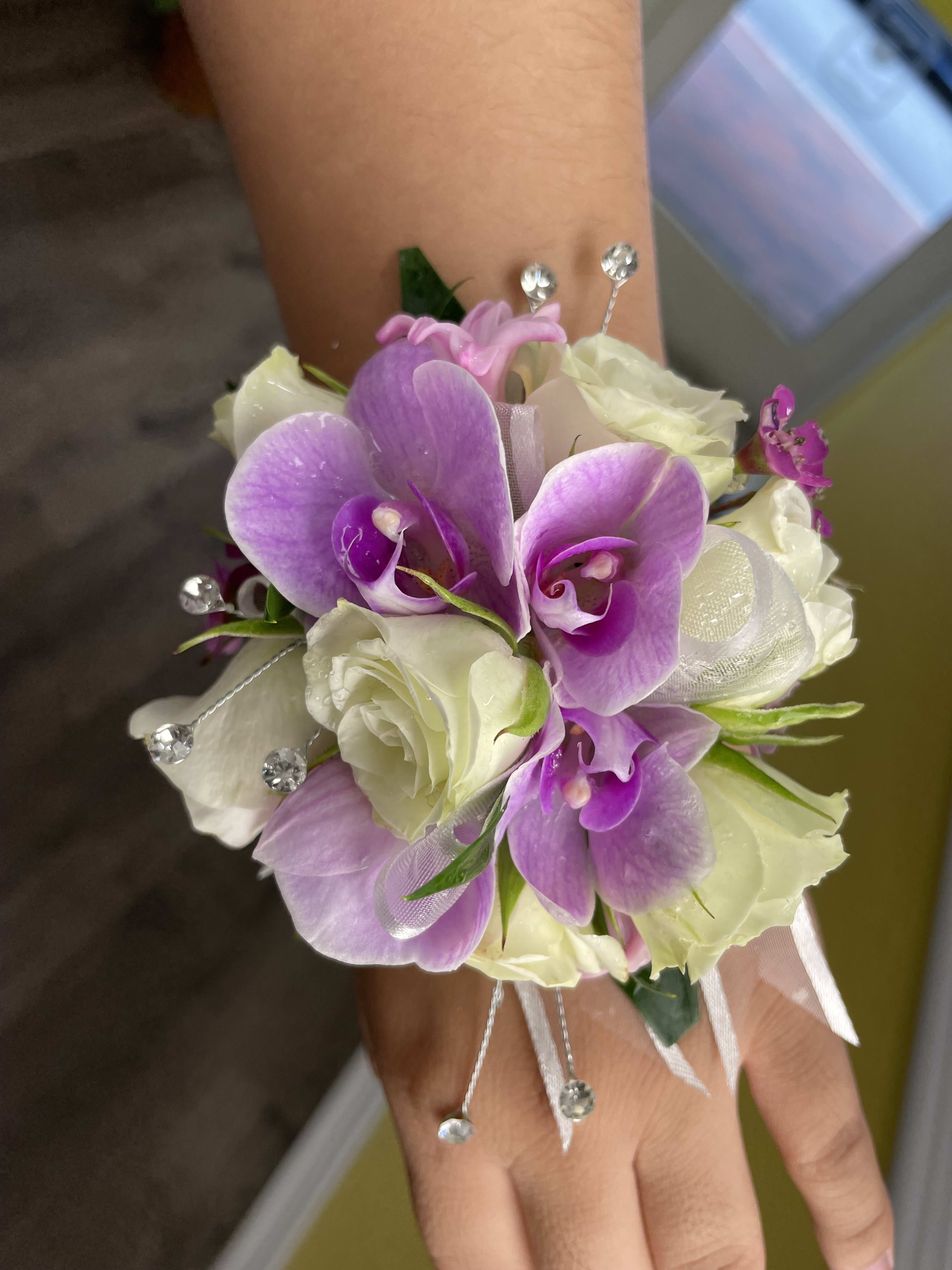 Orchid Corsage Orchid Corsage - An orchid corsage that will compliment your special day! The orchid colors can be changed so don't hesitate to ask.