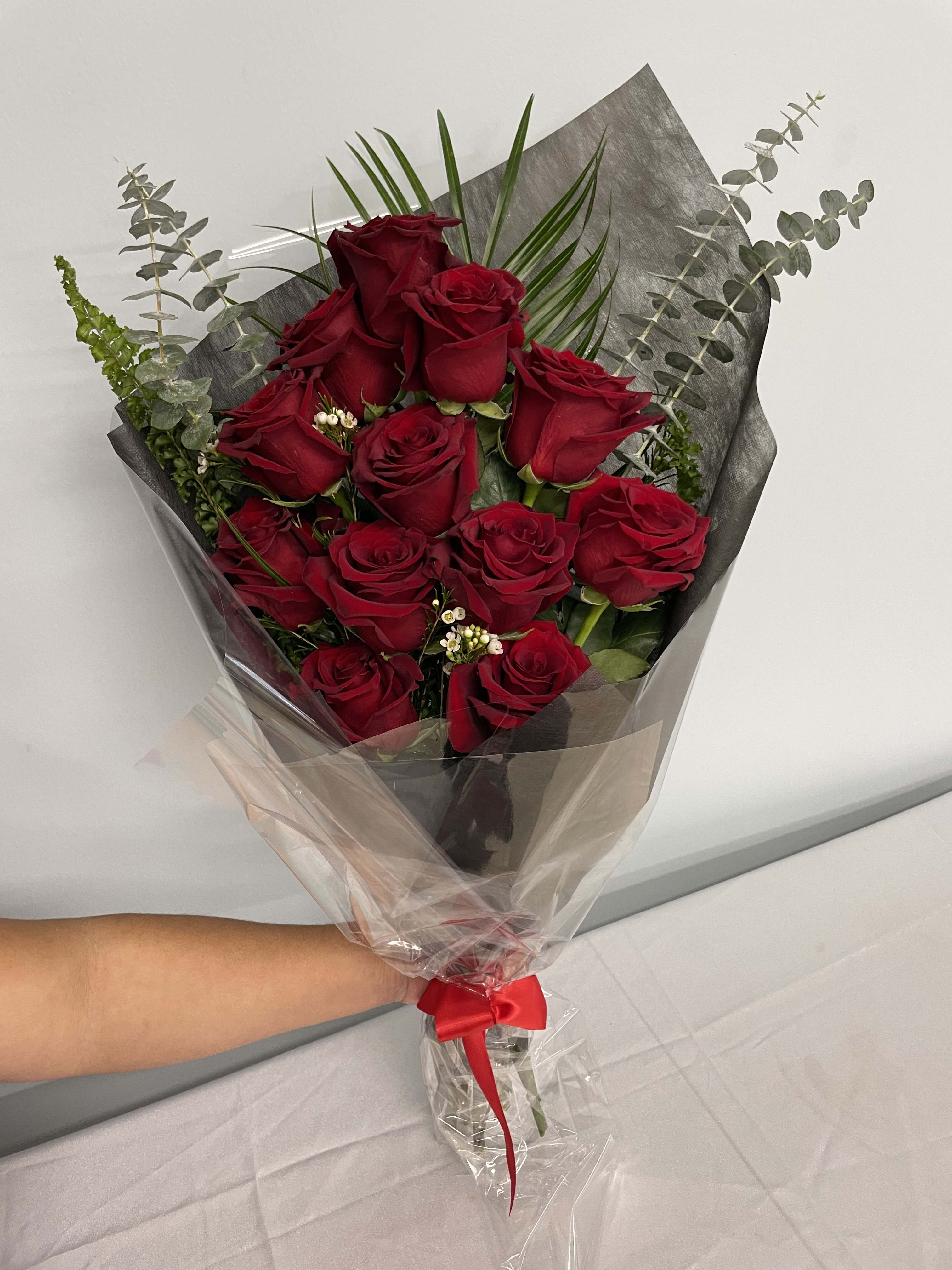 Passionate  - A red rose bouquet to show ones love and passion for your significant other. A very special gesture to give on any day or special occasion.   NOTE: **The rose color can be changed upon request**