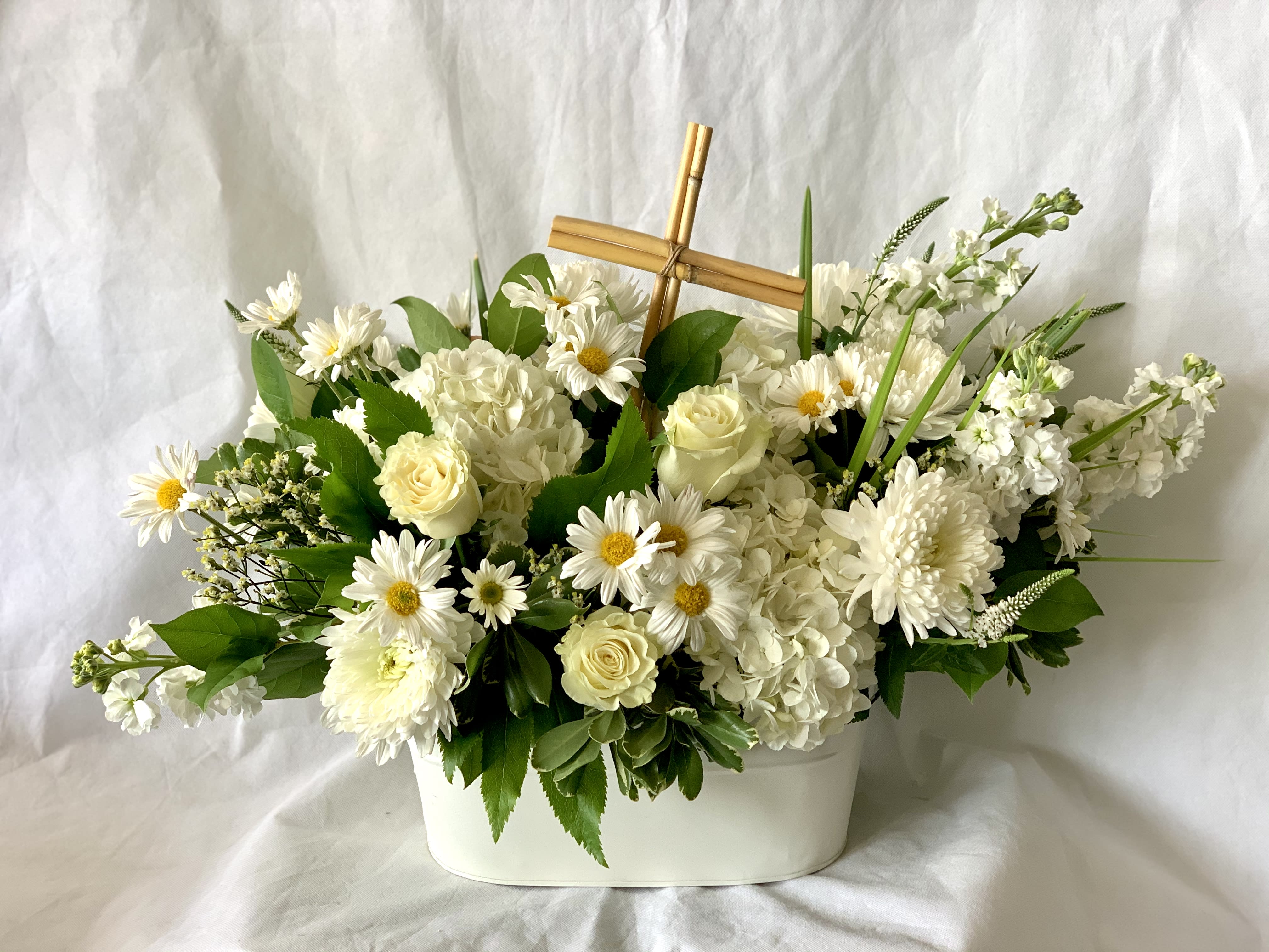sympathy cross arrangement sympathy cross arrangement - a bamboo cross adorn this elegant white arrangement. Can be made in any color palate. You choose!