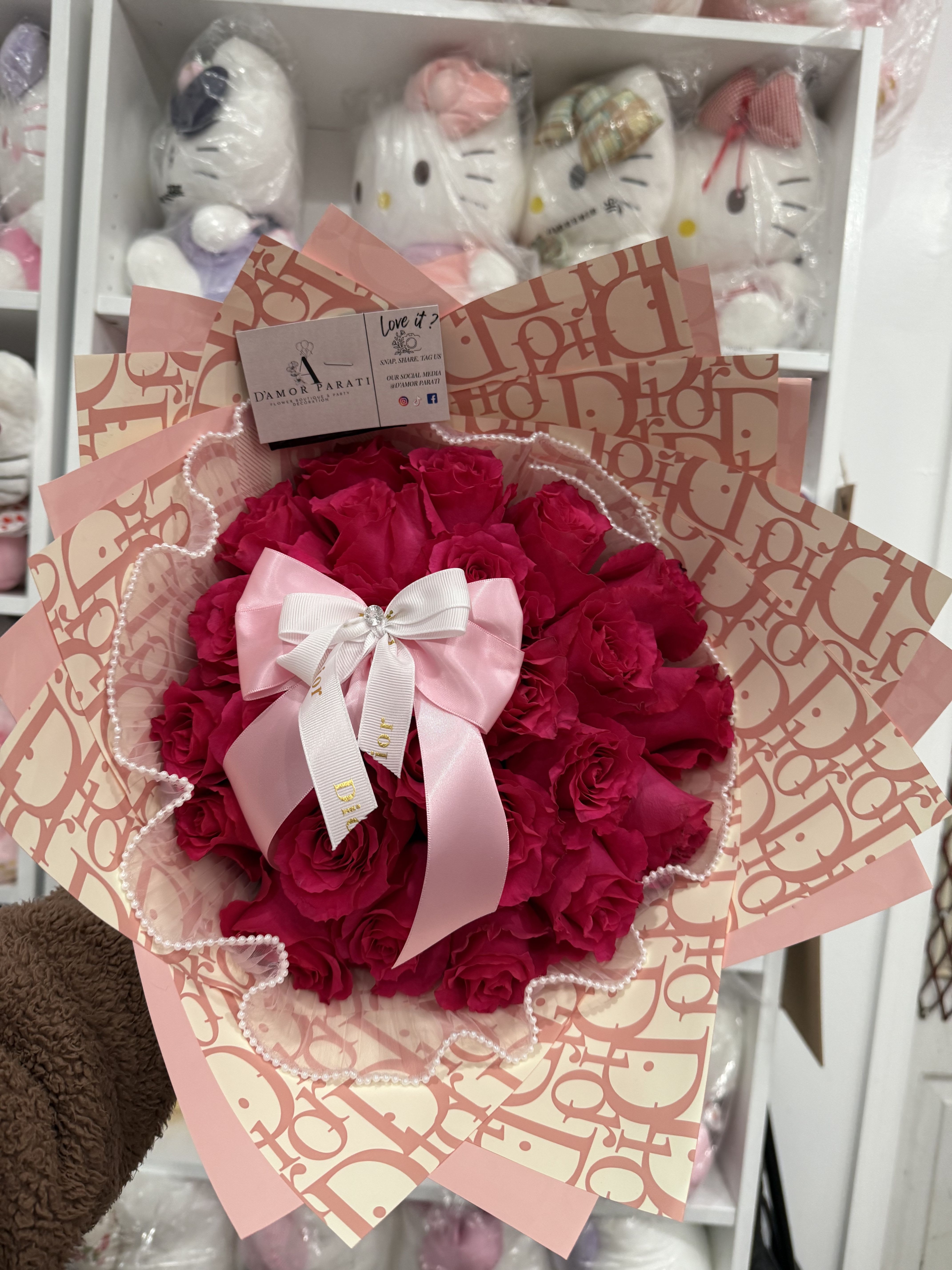 Adore Her Adore Her - 25 count hot pink premium roses , added with out most popular baby pink Dior paper, white pearls around the bouquet and accessorize with a double layer ribbon .
