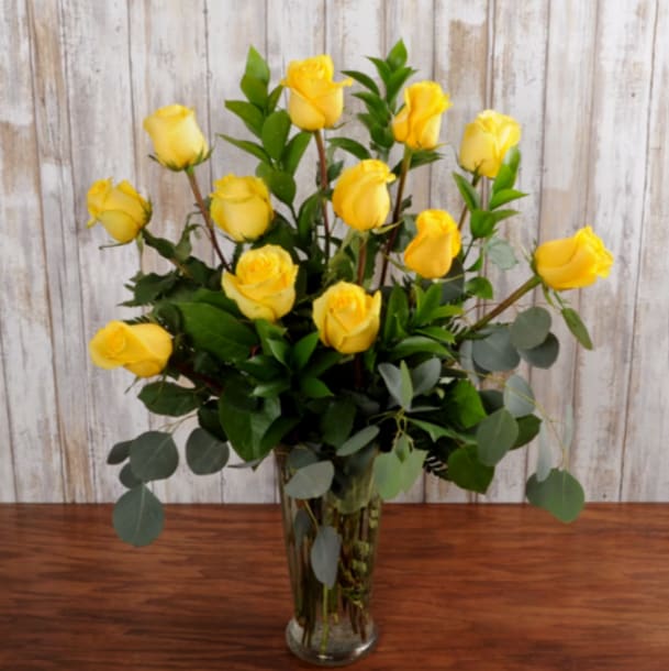 Dozen Yellow Roses Dozen Yellow Roses - Great, bright idea! Cheerful flower bouquet of one dozen yellow roses. An awesome flower pick for your fellow yellow-lover. Vase and greenery will vary due to availability.