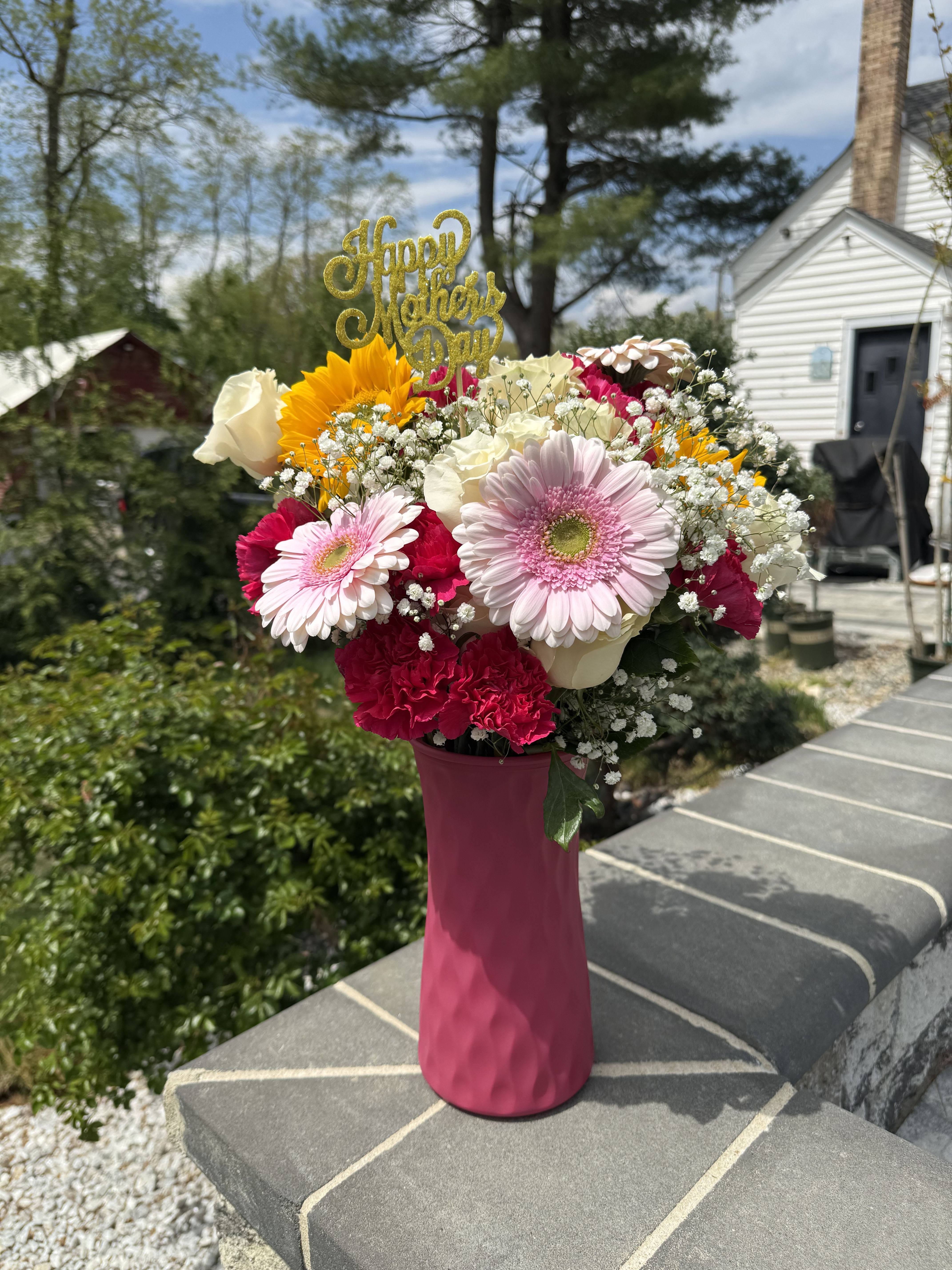 Love for Mom Love for Mom - A beautiful mix of blooms arrangement perfect for this Mother’s Day in the tones of pink, yellow and white. Some of the flowers included are sunflowers, roses, carnations and gerberas.