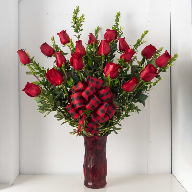 18 Roses arrangement - 18 Rose arrangement in vase, front facing (roses can be any color upon request) Substitutions: If some flowers and/or the vase are not available there will be minor substitutions.