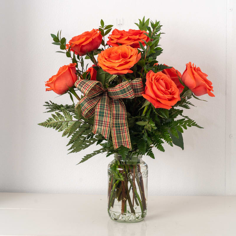 Bright Smiles - 6 rose arrangement in vase, (roses can be any color upon request) Substitutions: If some flowers and/or the vase are not available there will be minor substitutions.