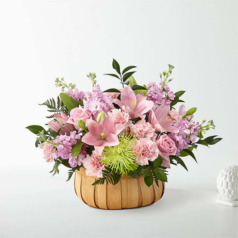 Beautiful Spirit Basket - Come close, flower lovers, because Irvine Village Flowers is weaving a tale of care and cheer! Imagine this: a gorgeous bouquet brimming with carnations, stock, roses, lilies, and Fuji mums, all nestled in a beautifully crafted basket. It’s a classic gem for souls who cherish heartfelt gestures and a big dose of love!  Picture this vibrant scene—carnations bursting with admiration, lilies glowing with hope, roses whispering sweet affection, stock adding a fragrant hug, and Fuji mums bringing a pop of joy. At Irvine Village Flowers, we’ve gathered these blooms to let someone special know just how much you care. Each flower is a thoughtful reminder of your support, delivered in a charming basket that’s as lovely as the sentiment behind it. It’s the perfect way to tell your soulmate, friend, or family, “I’m here for you!”  Let’s shine a light on these beauties! Carnations are the champs of devotion, lasting long and strong. Lilies lift spirits with their elegant grace, while roses sprinkle timeless love. Stock adds a soft, sweet scent, and Fuji mums dance in with bold, happy vibes. Together, they’re a bouquet that warms hearts and brightens days.  Pop over to Irvine Village Flowers—online or in-store—and let us craft this floral embrace for you. With our happy Irvine flower delivery, it’ll arrive fresh, fabulous, and ready to spread comfort and joy wherever it lands!