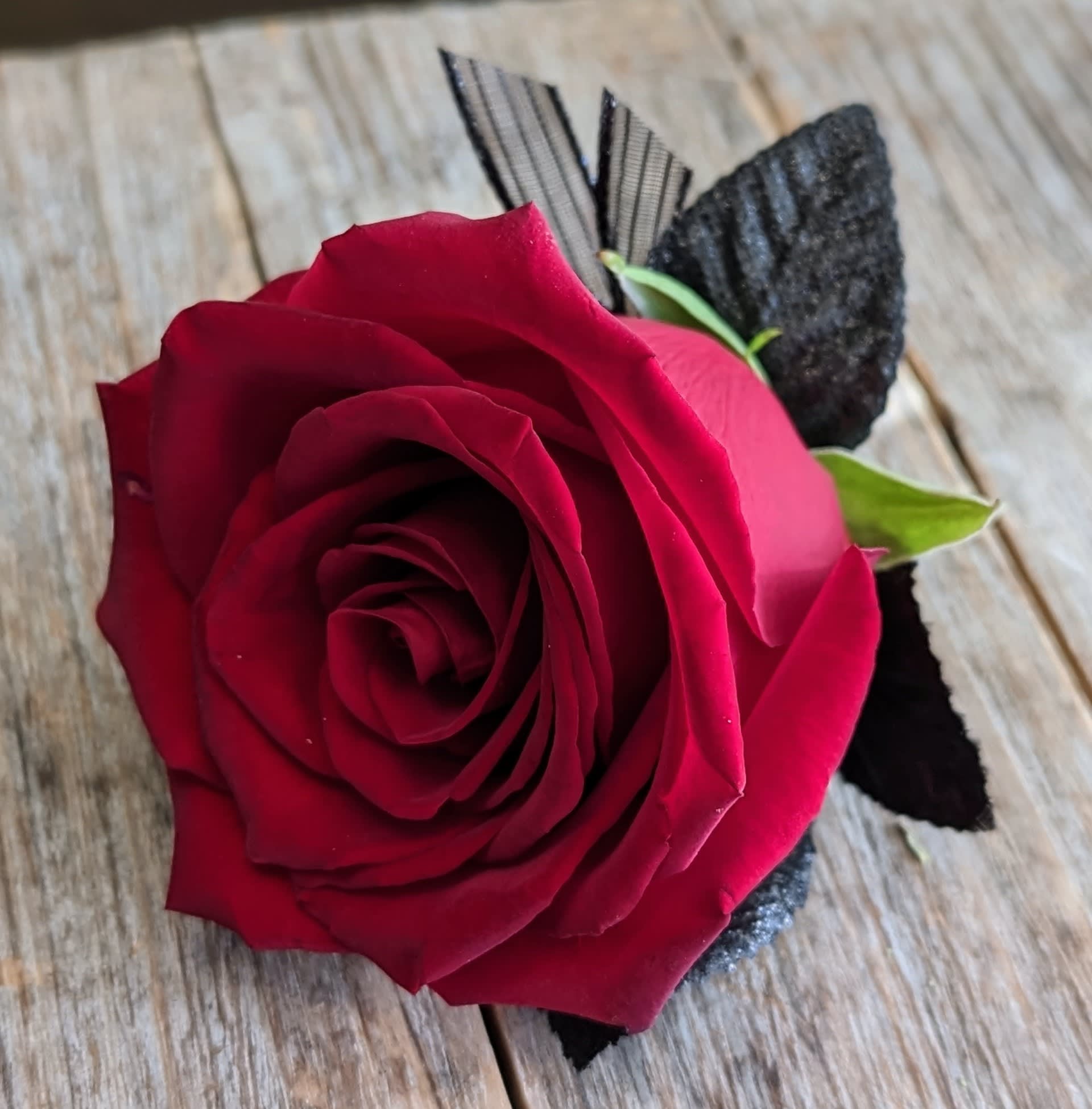 Single Red Rose Boutonniere - A single red rose boutonniere.