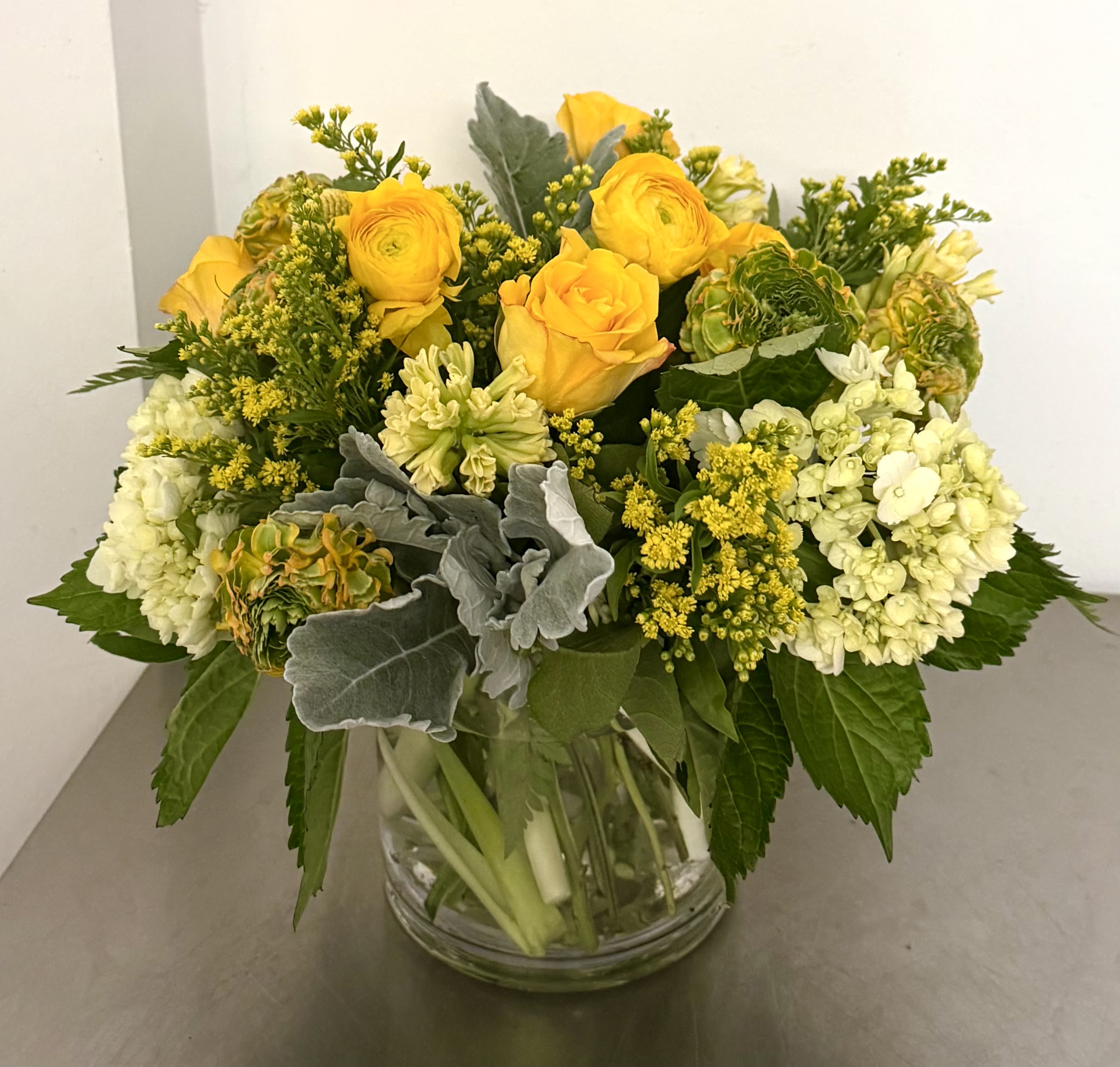 Flower bouquet in yellow - Beautiful ranunculus, hydrangeas, hyacinths and roses 