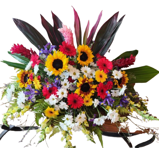 Funeral Casket Spray - This Casket apray includes Tropical Flowers and Sunflowers and is very colorful. 