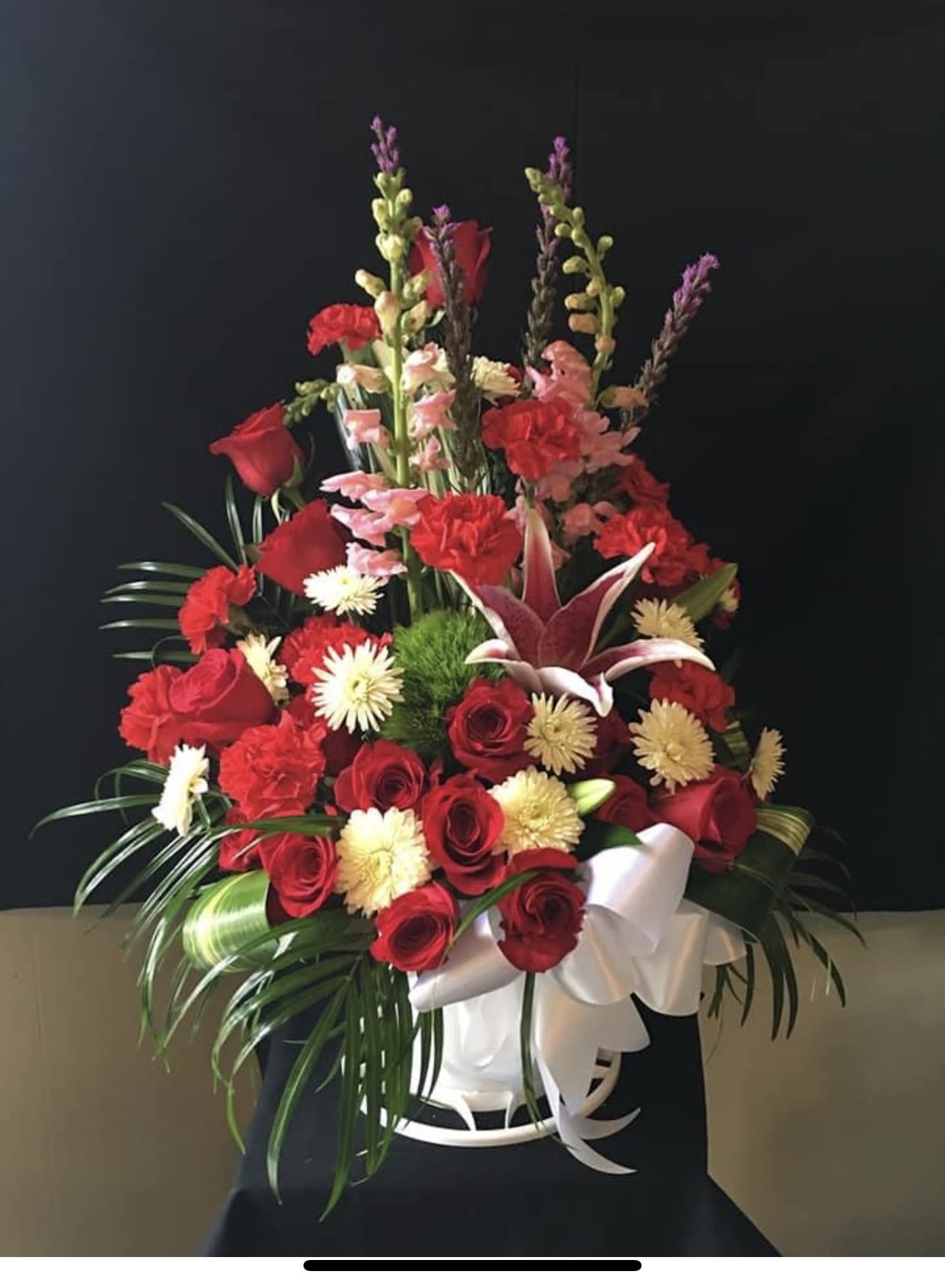 Gracious Sympathy basket - One sided arrangement floral arrangement 