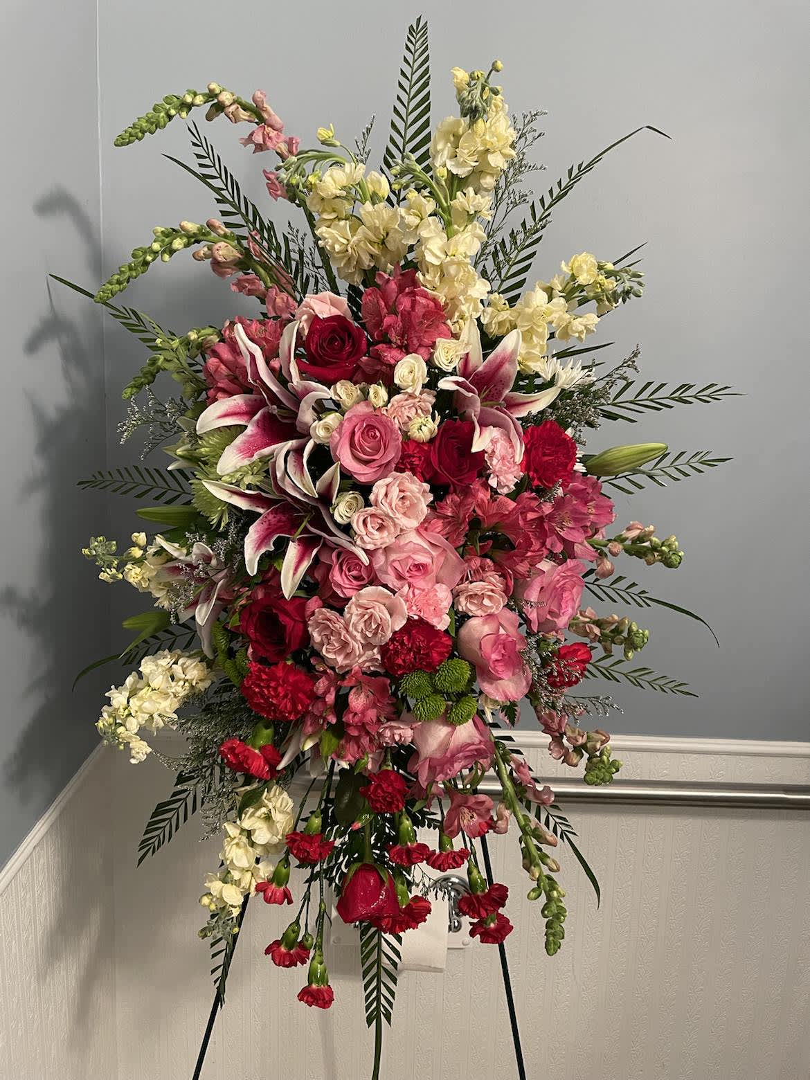 Sentimental Spray Sentimental Spray - Pink/White Lillies, White Snap Dragons, Ferns, Dark/Light Pink/Red Roses, Lime Green Button Mums, White/Pink Spray Roses, White/Pink Carnations