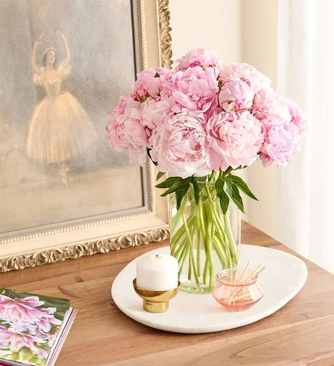Precious Peony Bouquet - LIMITED AVAILABILITY only for Mother Day Create lasting moments with the lush beauty of our pink peony bouquet. The rich fragrance and texture of these elegant, ever-popular blooms brings a nostalgia for gathering fresh-cut flowers right from the garden.  Standard  is 10 blooms In at clear vase   Premium is 20 blooms in at clear vase 