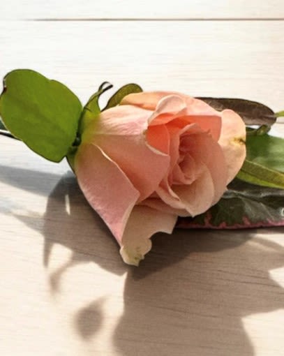 Custom Boutonniere (Pin-On or Pocket) - A custom boutonniere is a uniquely crafted floral accessory designed to complement an individual's attire for special occasions such as weddings, proms, or formal events. Each boutonniere is tailored to reflect the personality and style of the wearer, often featuring a curated selection of fresh flowers, greenery, and decorative elements like ribbons or pins.   The design can range from classic to contemporary, incorporating seasonal blooms and personalized touches that resonate with the event’s theme. Whether it’s a single elegant rose, a cluster of wildflowers, or a sleek and minimalist design, a custom boutonniere adds a distinctive flair to any outfit, making it a meaningful statement piece that celebrates individual expression and connection to the occasion.