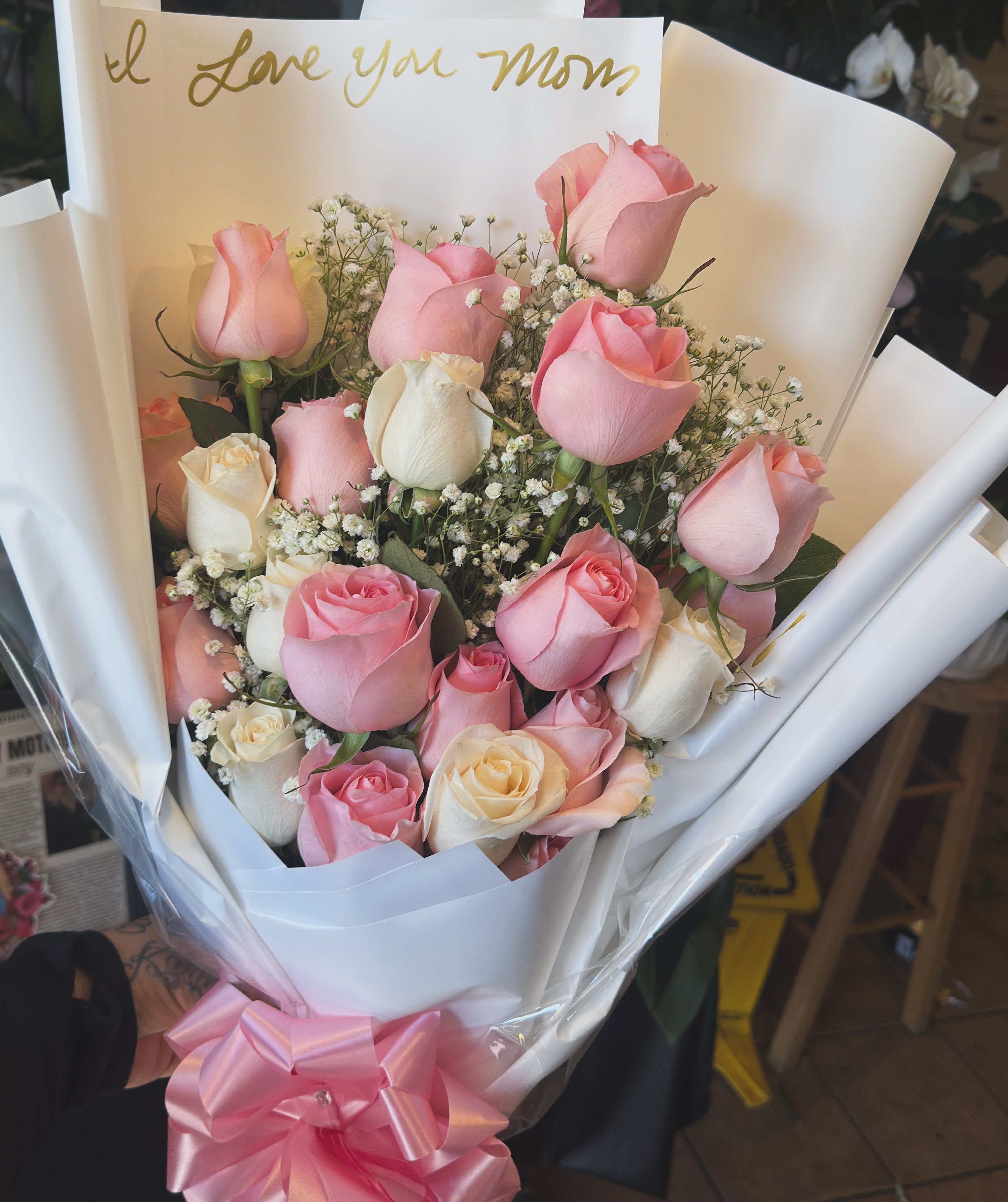 Sweet Devotion  - Soft blush and ivory roses nestled in a cloud of baby's breath — this timeless bouquet says “I love you, Mom” in the gentlest way. Romantic, classic, and full of gratitude.