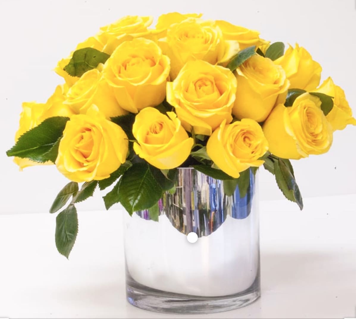 Yellow Love bouquet Yellow Love bouquet - One dozen premium yellow roses design short and stylish in a glass cube or cylinder. ***The deluxe option for this bouquet upgrades your arrangement to two dozen roses