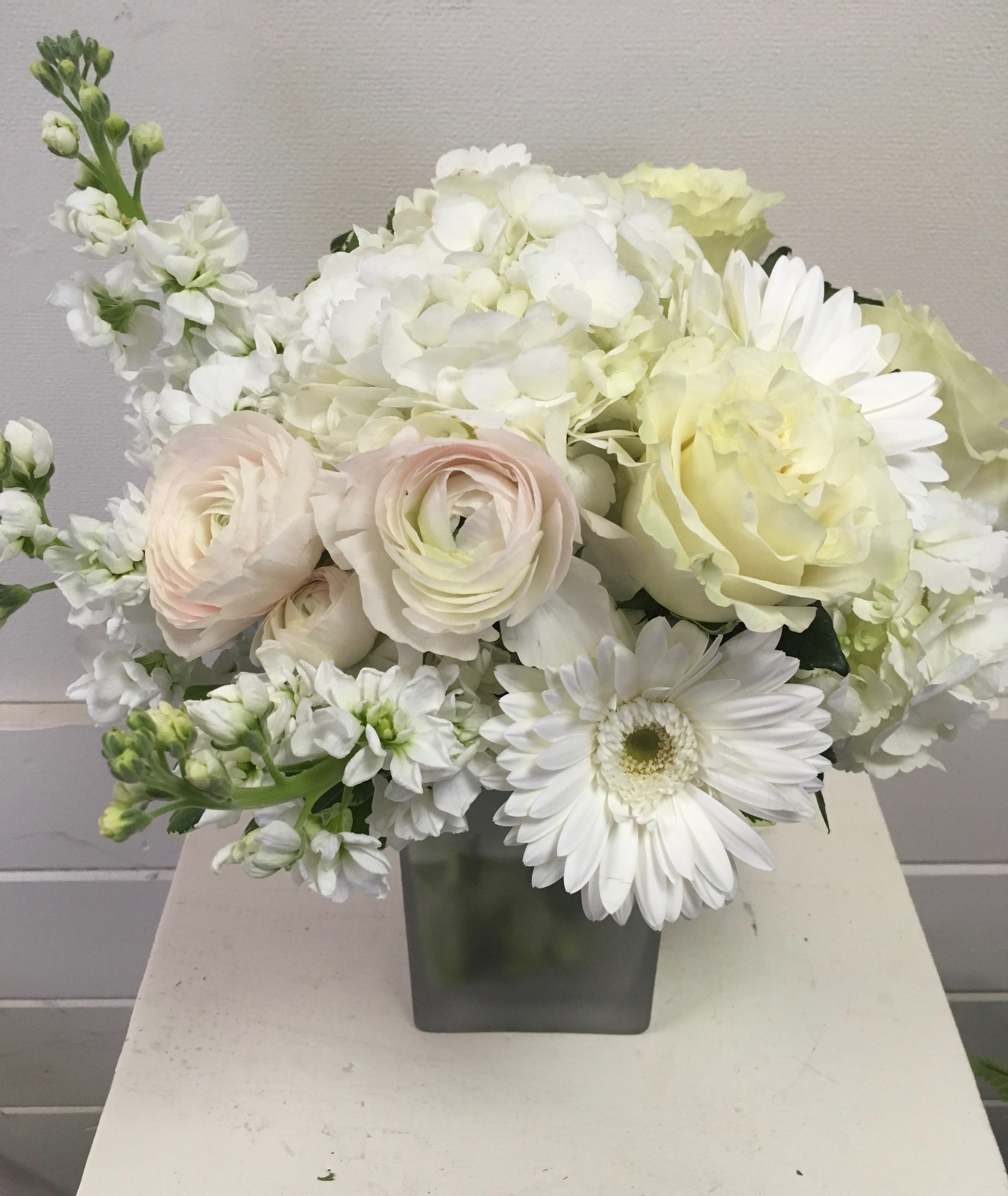 Pure  - Pretty white and blush flowers including ranunculus, stock, hydrangea , roses and more