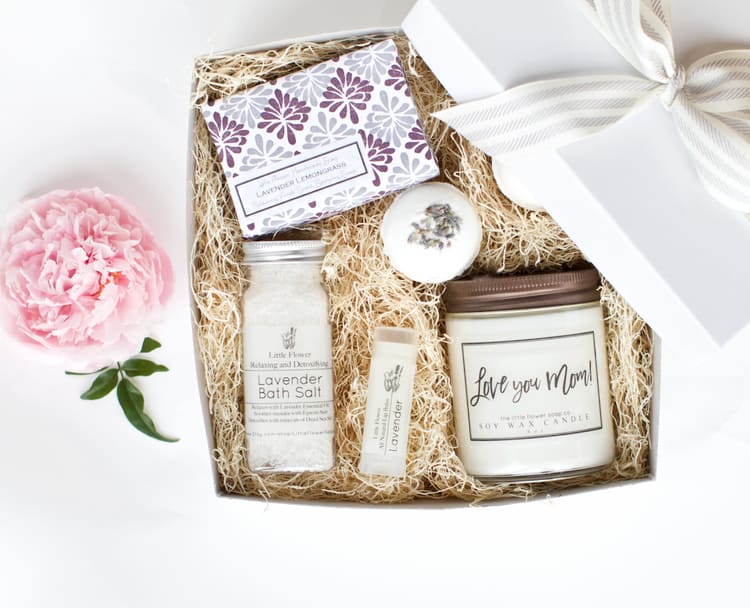 Luxury Lavender Spa Set Luxury Lavender Spa Set - Ready to Gift Luxury Spa Box Measures 8 x 8 and comes in a white gift box with an organic cotton grey and white stripe bow ( INCLUDES: 1 - 6oz BIG soap Lavender Lemongrass 1 - Lavender Lip Balm 1 - 4oz Lavender Bath Salt with Dead Sea Salt and Epsom 2 - 2oz Lavender Bath Bombs topped with rose petals 1 - 8oz Lavender Candle 1 - White gift box with Grey and Ivory Organic Cotton striped Ribbon