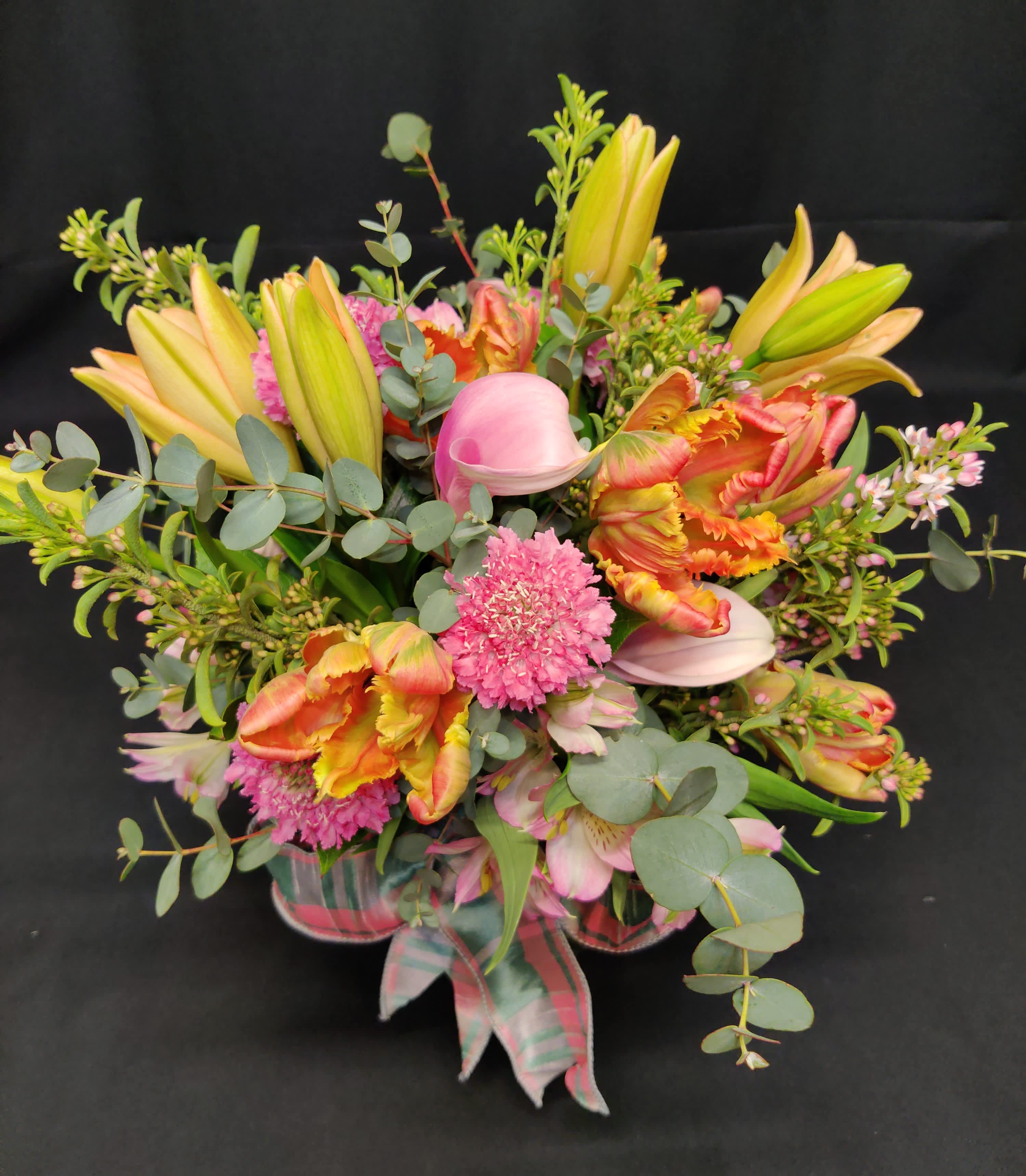 Spring Centerpiece with Fringe Tulips Spring Centerpiece with Fringe Tulips - Spring mixed bouquet in a round centerpiece design. Perfect for Easter! Pastel bouncy spring color and many of spring's harbingers such as lillies and parrot fringe tulips.