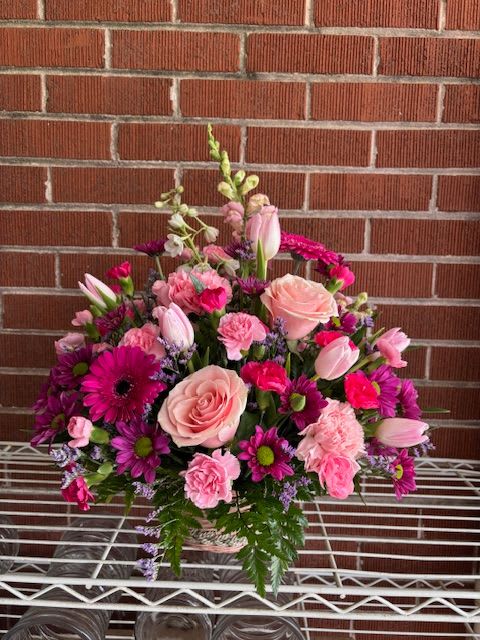 DAISY-MAE DAISY-MAE - WICKER BASKET WITH PINK GERBERS, PINK ROSES AND PURPLE DAISIES