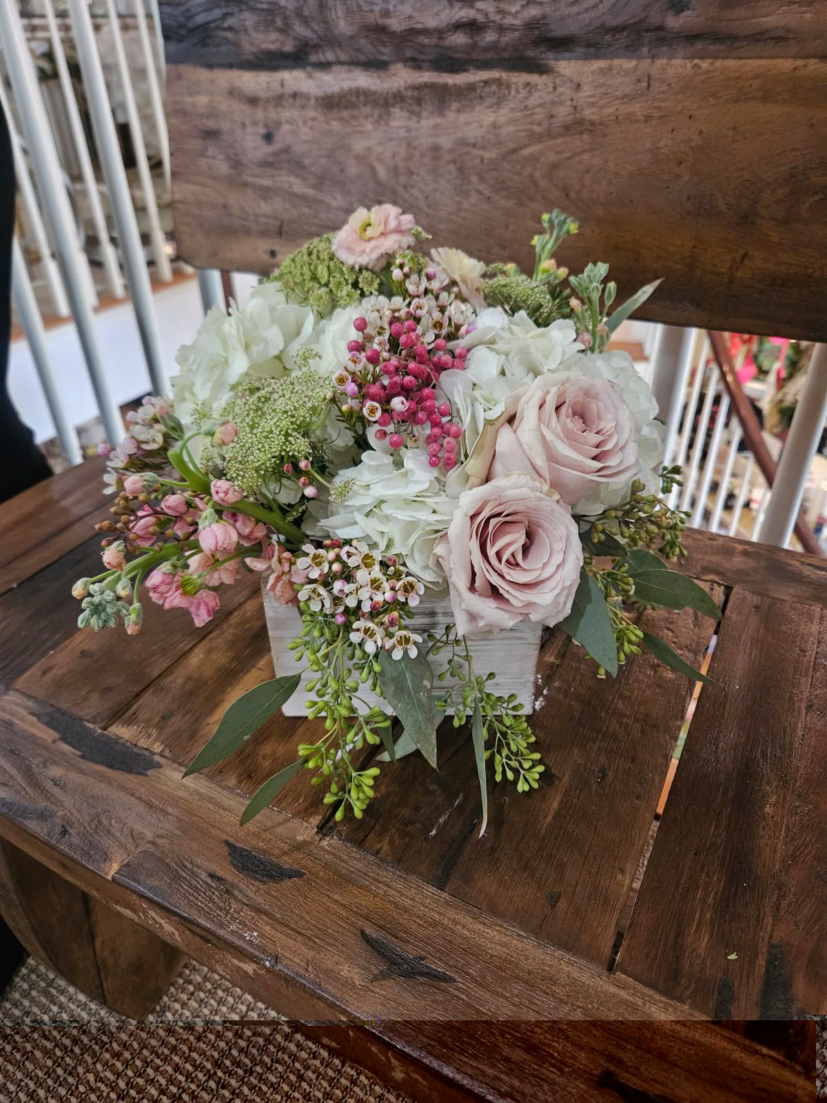 Shades of Love Box  - Roses, cymbidium orchids, hydrangea, pink stock, ranunculus, tulips, wax flower, berries, seeded eucalyptus arranged in a wooden box