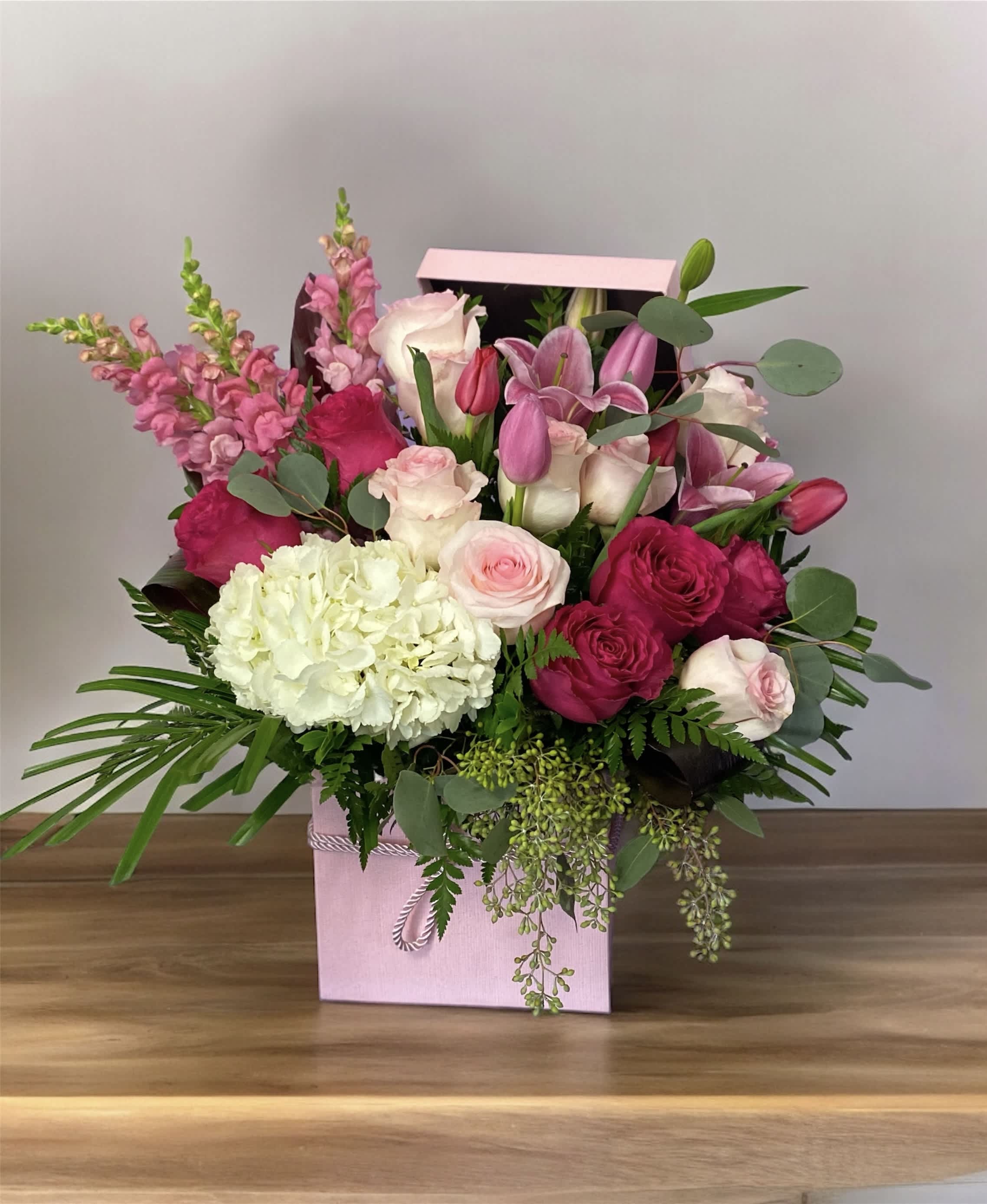 Pink Delight 0126 Pink Delight 0126 - This vibrant arrangement features a blush mix of pink/red roses and white hydrangeas, creating a stunning and uplifting display that adds a touch of elegance to any environment.
