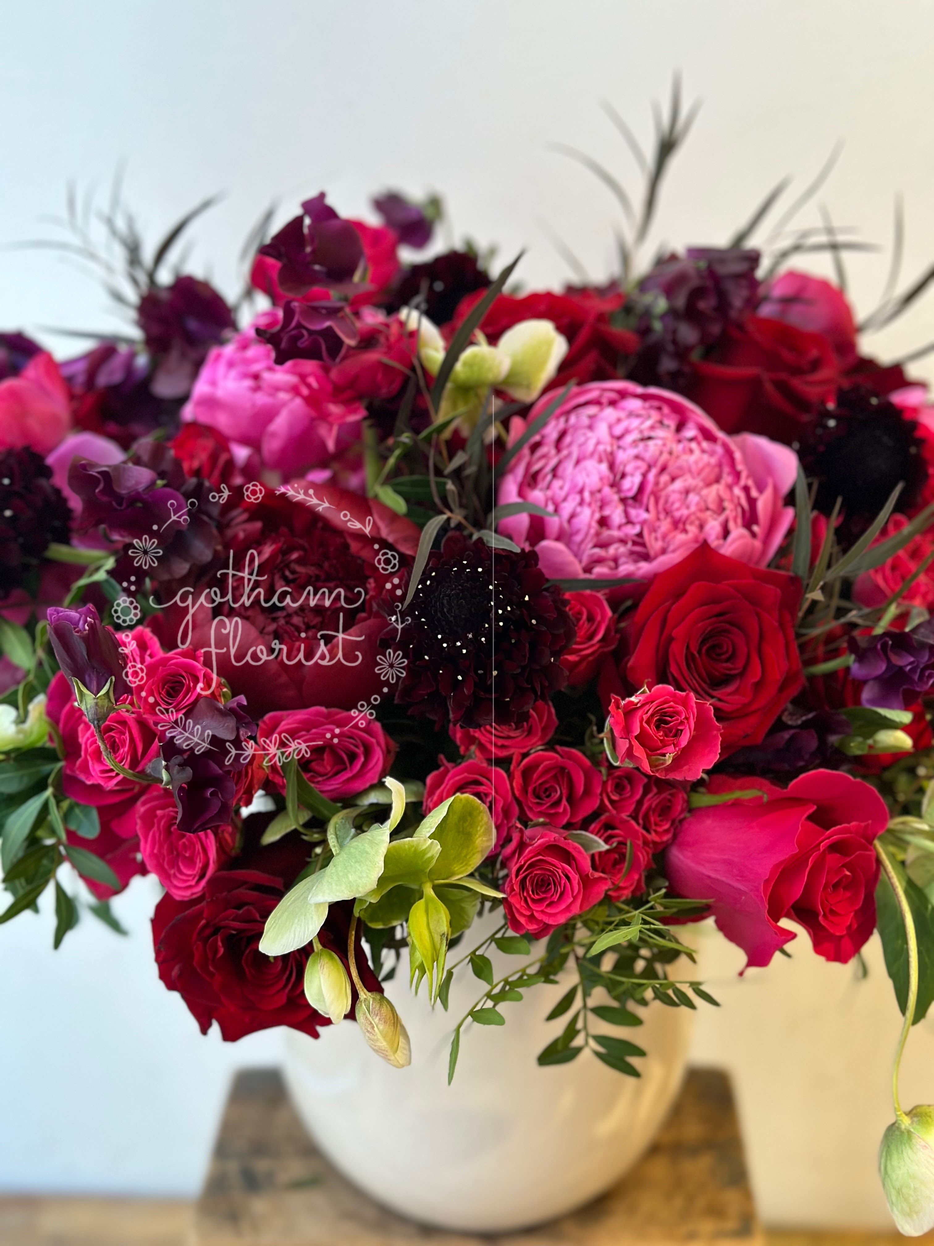 Glamour  - A gorgeous mix of pink and red roses accompanied by ranunculus and other luxurious blooms. Send the #bestroses from the #bestflorist in New york! #bestfloristnyc