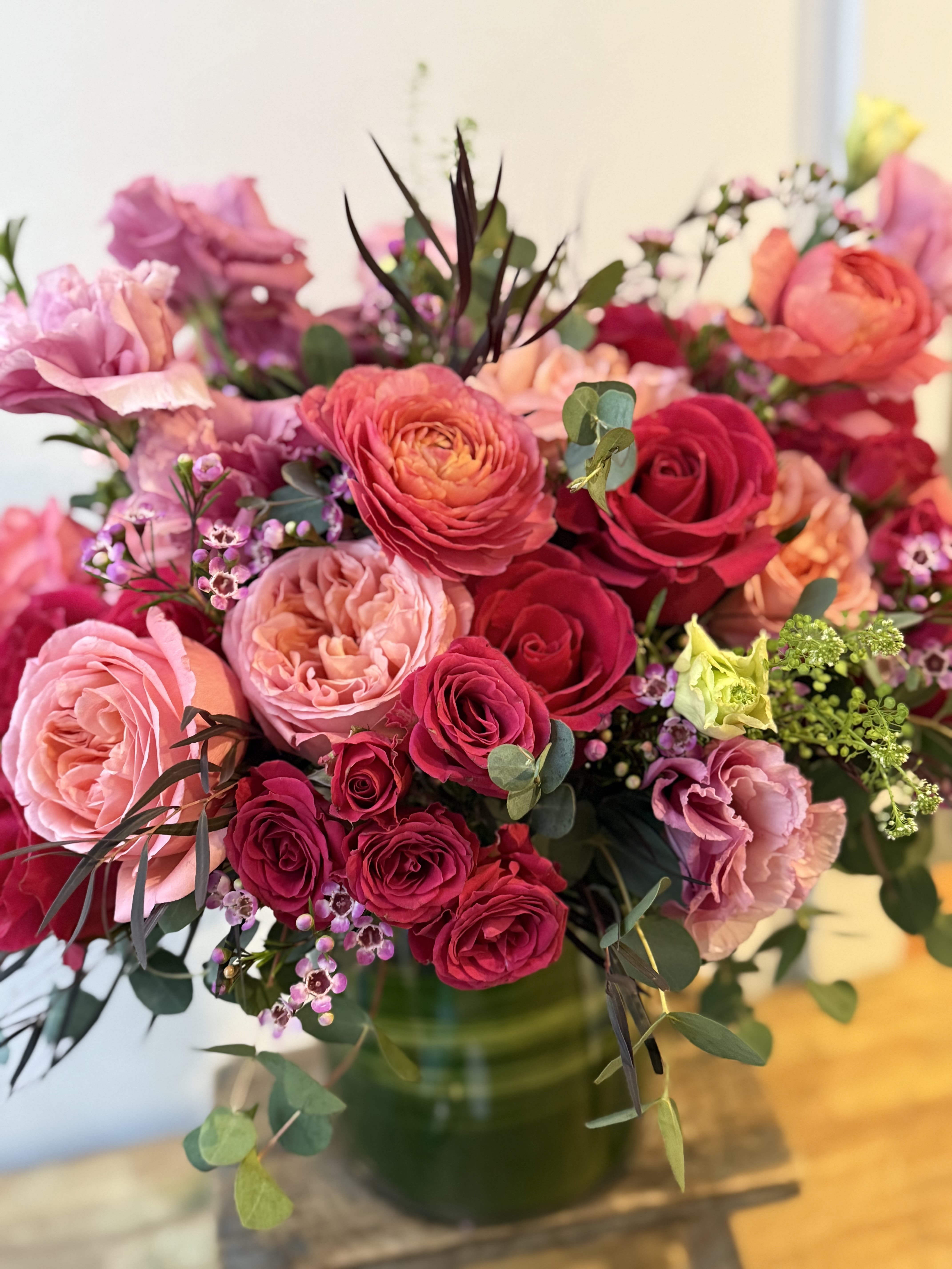 Love Story - Blush pink and hot pink roses, arranged with spray roses, eucalyptus and orchids in a beautiful white vase. A lush gorgeous design for that person you love. #valentinesday Send the best flowers from the best flower shop in New York. We offer same day flower delivery in Manhattan, Queens, Bronx, Brooklyn, Staten Island and West Chester counties. We have the prettiest and most luxurious flowers to choose from and our designs are unique and whimsical. We carry Peonies almost every day of the year!!#mercuryvase #weddingflowers #luxuryflowers #ranunculus #peony #peonies #flowerdelivery #samedaydelivery #roses #valentinesdayroses 