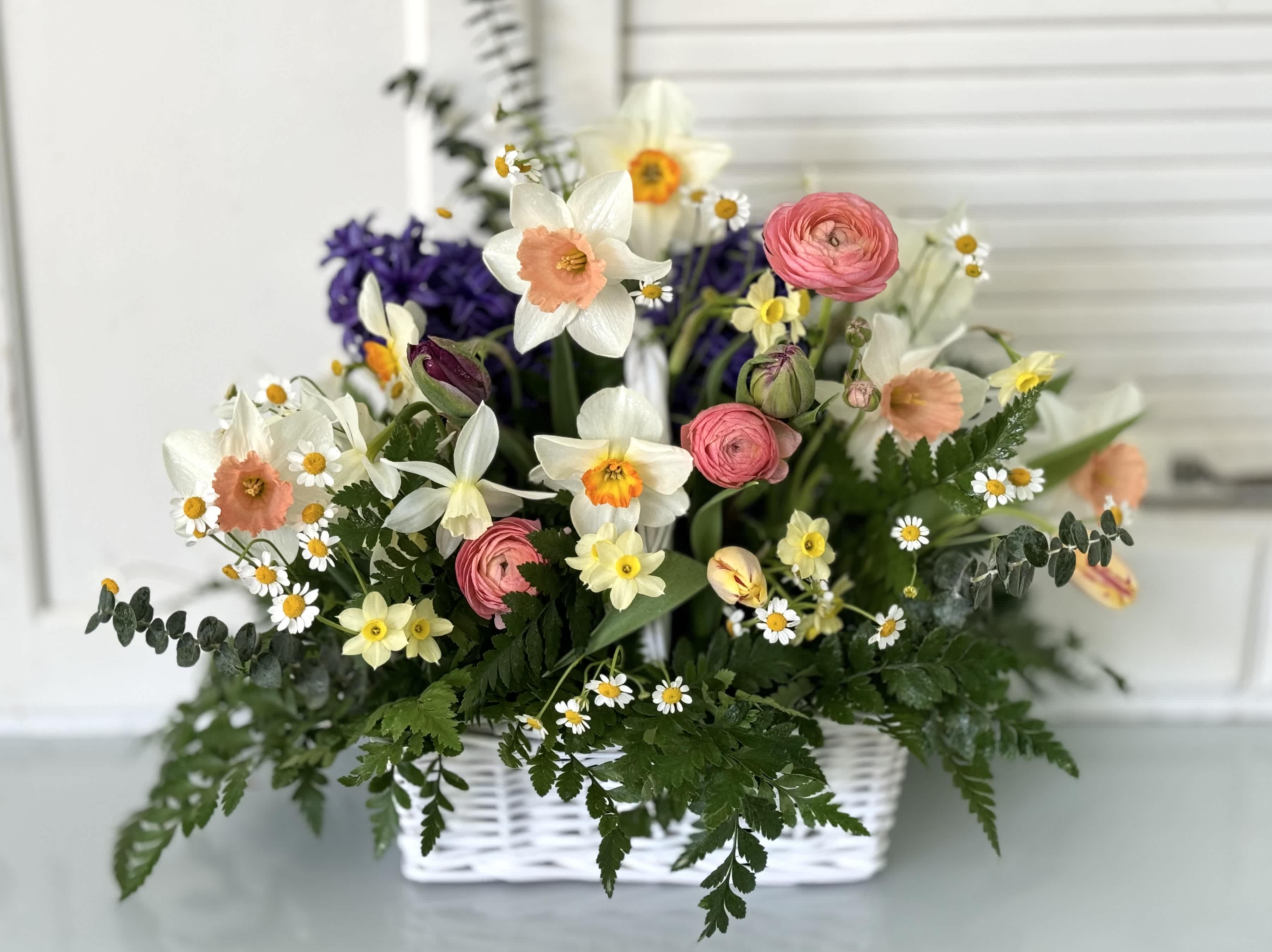 Spring has sprung - April showers bring May flowers. This is a beautiful spring arrangement made with flowers grown and harvested from local Michigan flower farms. Specific flowers and colors vary with the season's availability. April through June only. Call for availability.