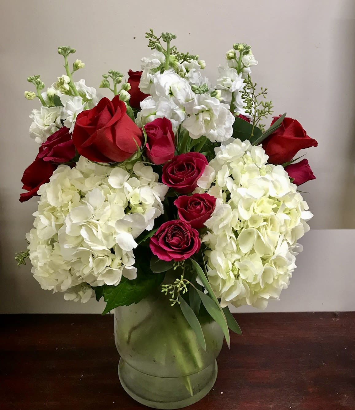 Exquisite Love - Show your special someone how much they mean to you with an exquisite bouquet of roses, hydrangeas, spray roses and stock designed in a modern style.    Special Care Instructions: Hydrangeas are known to be very dramatic flowers! They LOVE water. Please change out the water in the vase daily and spritz the petals down with water to keep them blooming for longer!