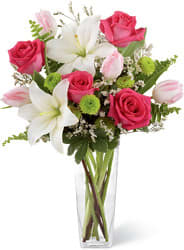 Floral Expressions Bouquet - Boasting a fresh from the garden look, this arrangement of fuchsia roses, pale pink tulips, white Asiatic Lilies, green button poms and lush greens, beautifully seated in a clear glass vase, create the perfect way to convey your sweetest spring wishes. Approximately 18&quot; H x 12&quot; W