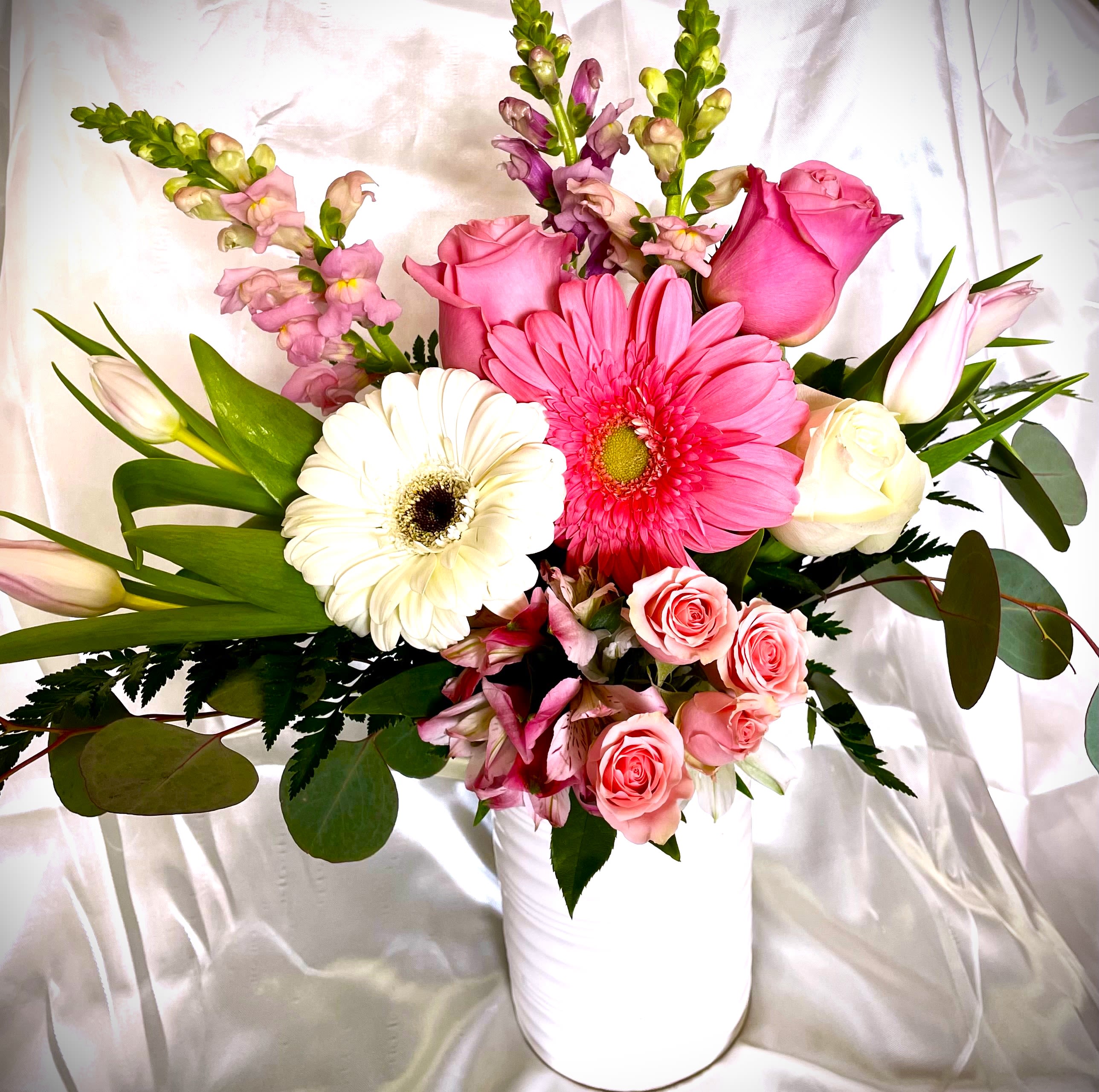 Loving You! - Premium white ceramic vase, with gorgeous gerbera daisies, tulips, Peruvian lilies, snapdragons, roses, greens and more. Let them know how special they are! 