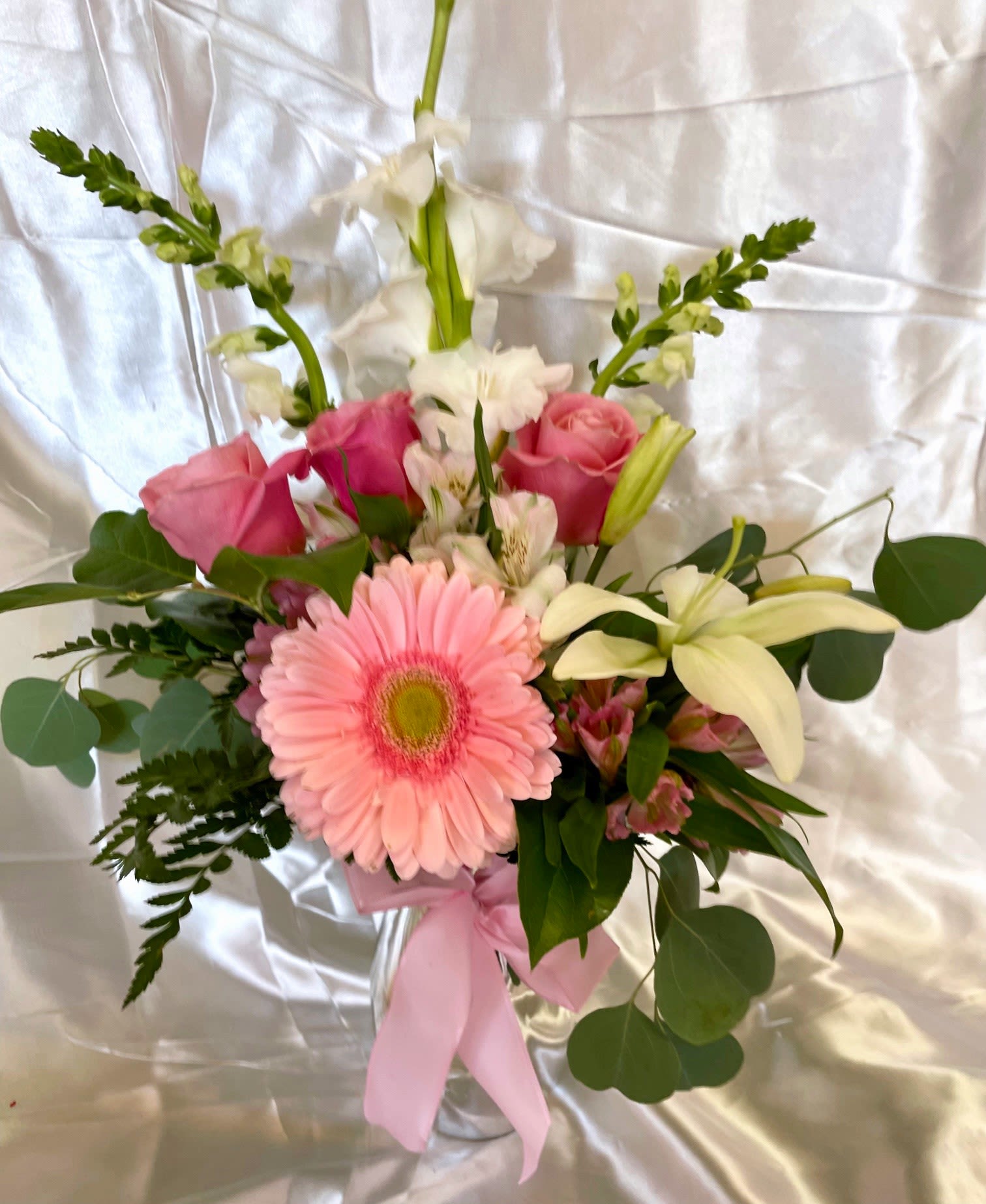 Pretty Little Love Pretty Little Love - As the name states, pretty arrangement of soft pinks, creams, and greens with silver dollar eucalyptus; roses, lilies, and gerberas.