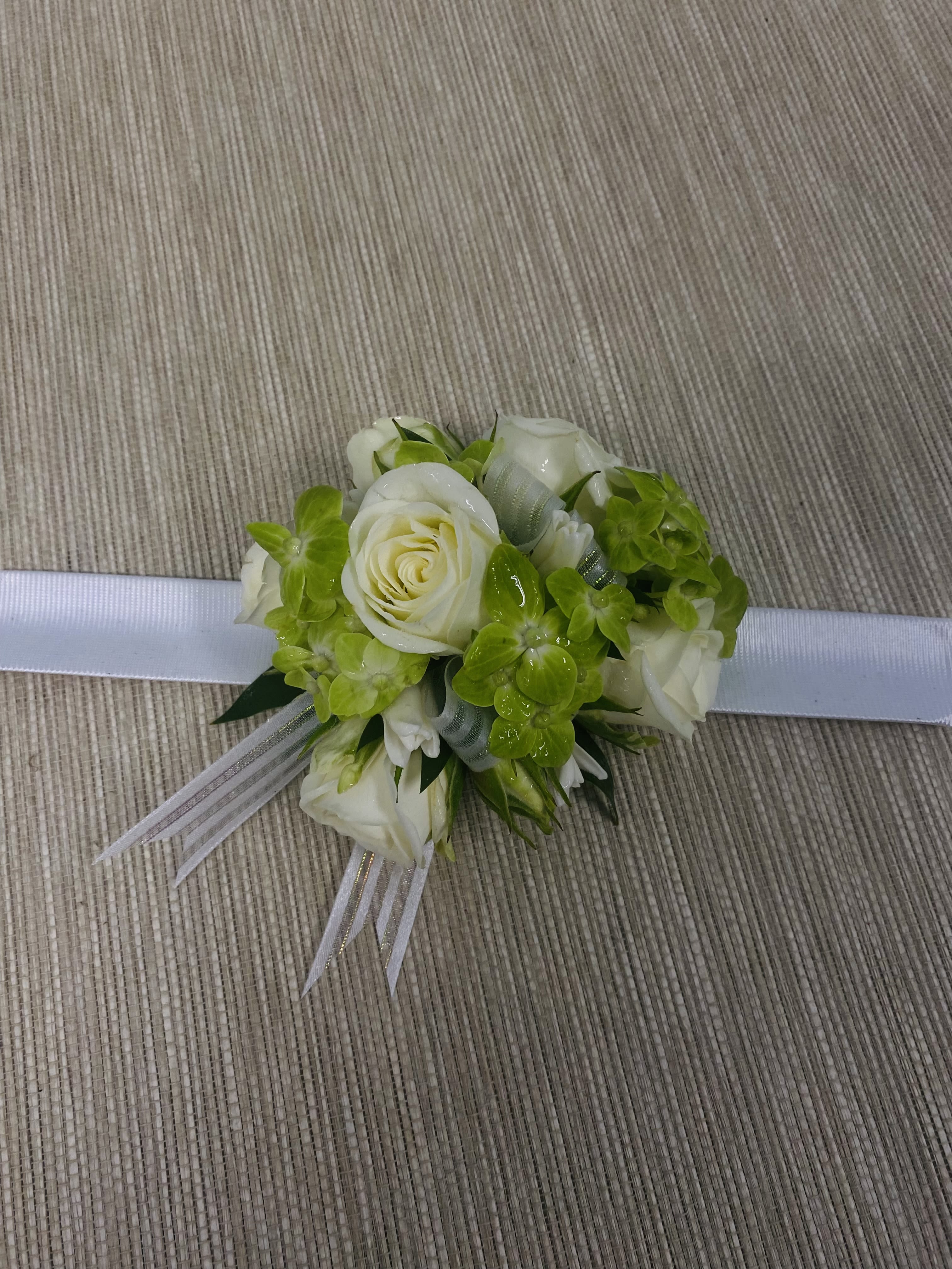 Spring Green Corsage Spring Green Corsage - A corsage consisting of white spray roses with a touch of green.