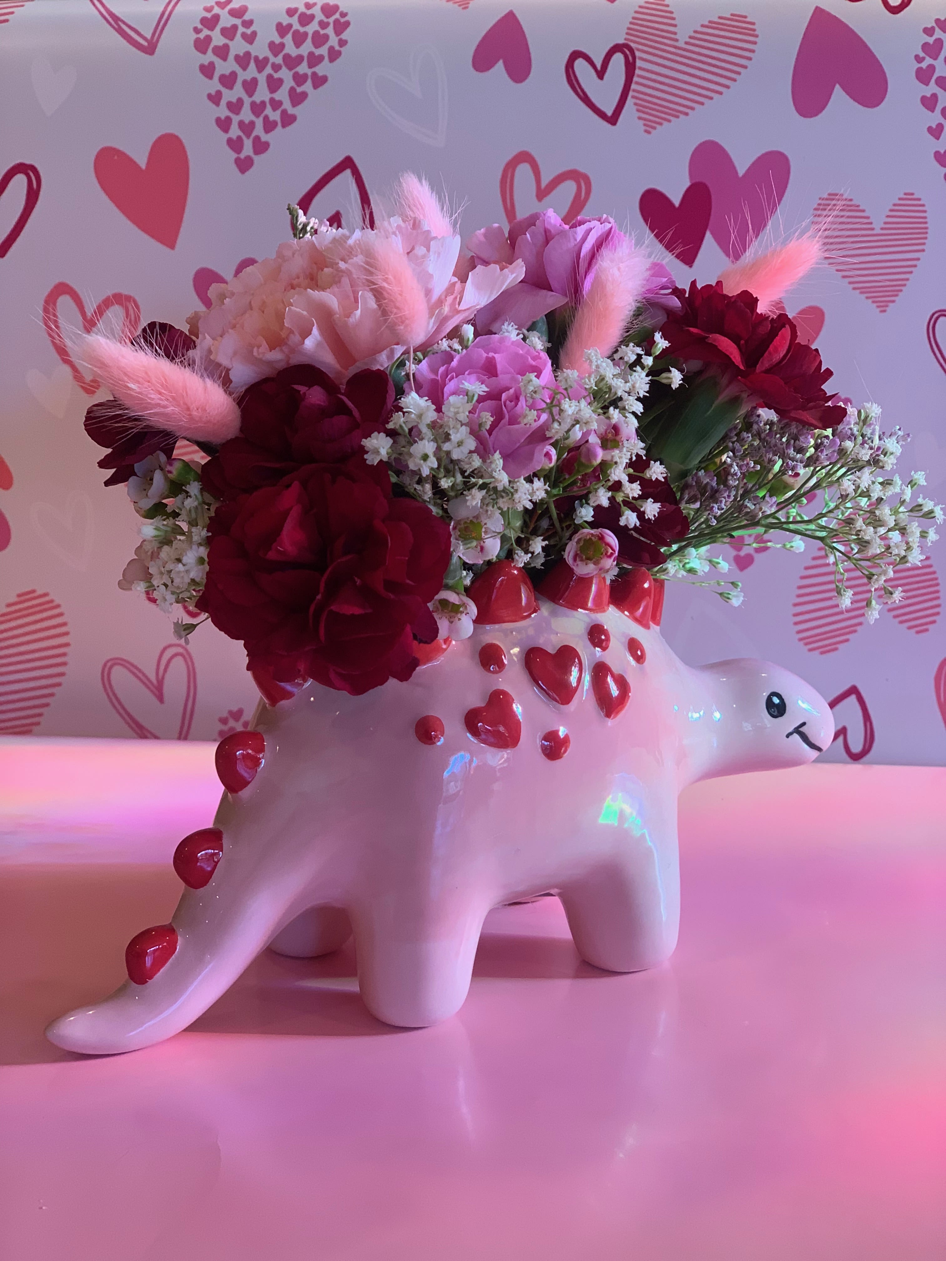Dino-Mite Valentine - TWO LEFT! Dino-Mite Valentine - TWO LEFT! - Hurry and snag one while they last, limited availability. May be subject to special holiday pricing. Flower selection will vary on availability.