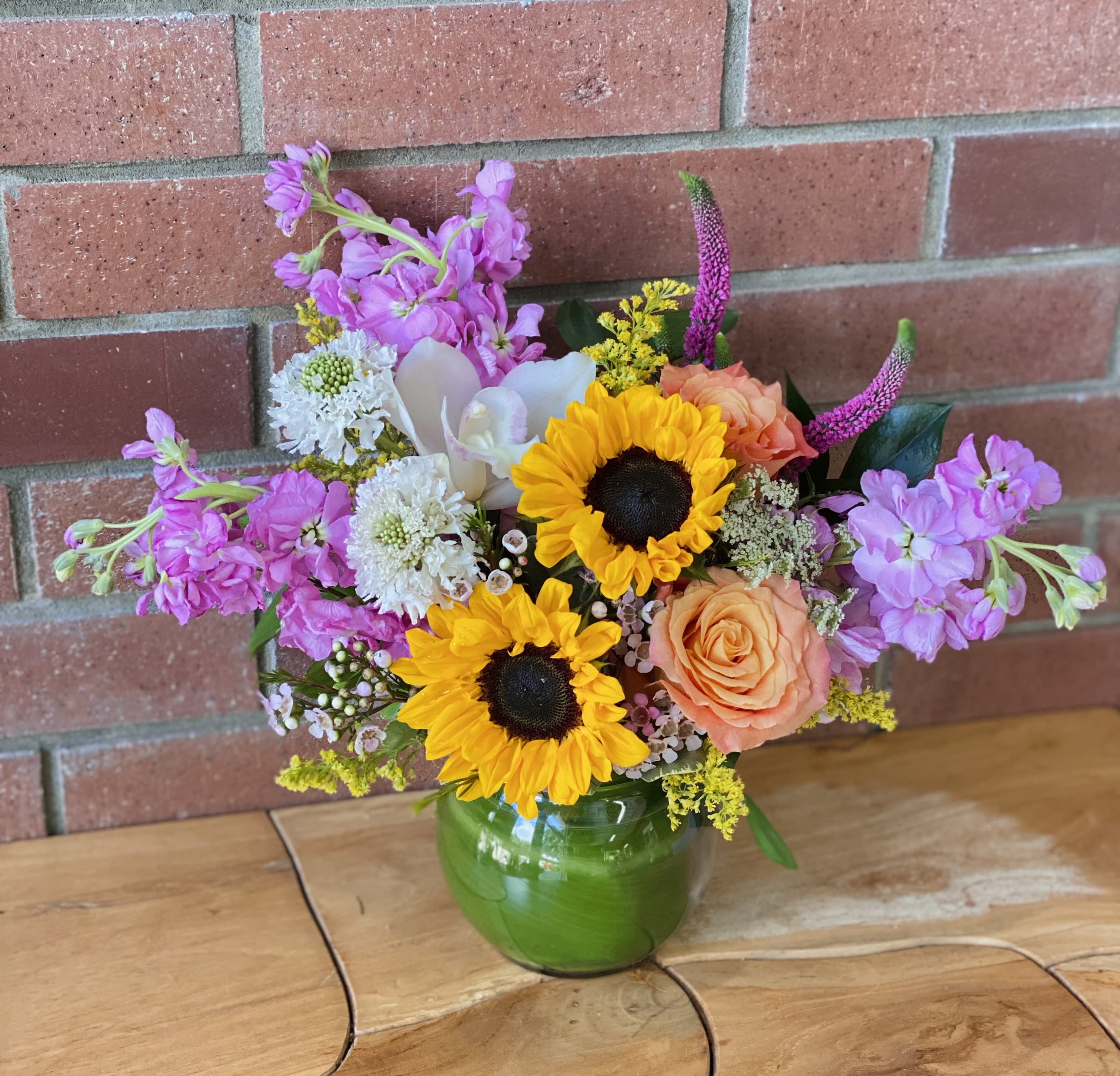 Summer Breeze Summer Breeze - Sunflowers, garden roses, fragrant stock, orchids, veronica, scabiosa arranged with premium greens and fillers in 4inch small bubble bowl. Pictured size "Standart" Deluxe - upgrade for 5inch bubble bowl. Premium- upgrade for 8inch bubble bowl.