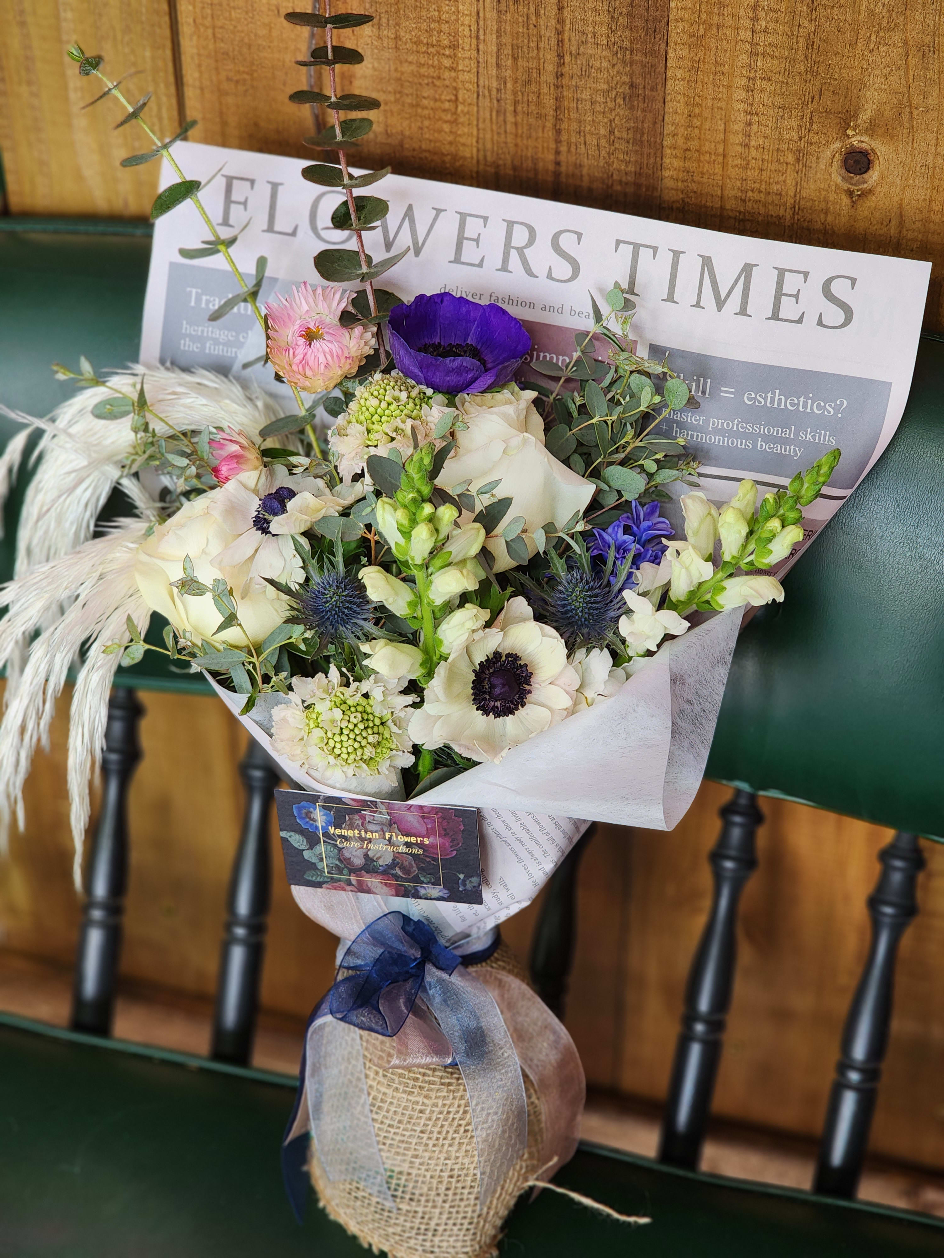 Weekly Wrapped Bouquet Weekly Wrapped Bouquet - Send a surprise bouquet of lush beautiful blooms wrapped with the most trendy and fun flower wraps. Arrives Alive with our bouquet stem sponge.
