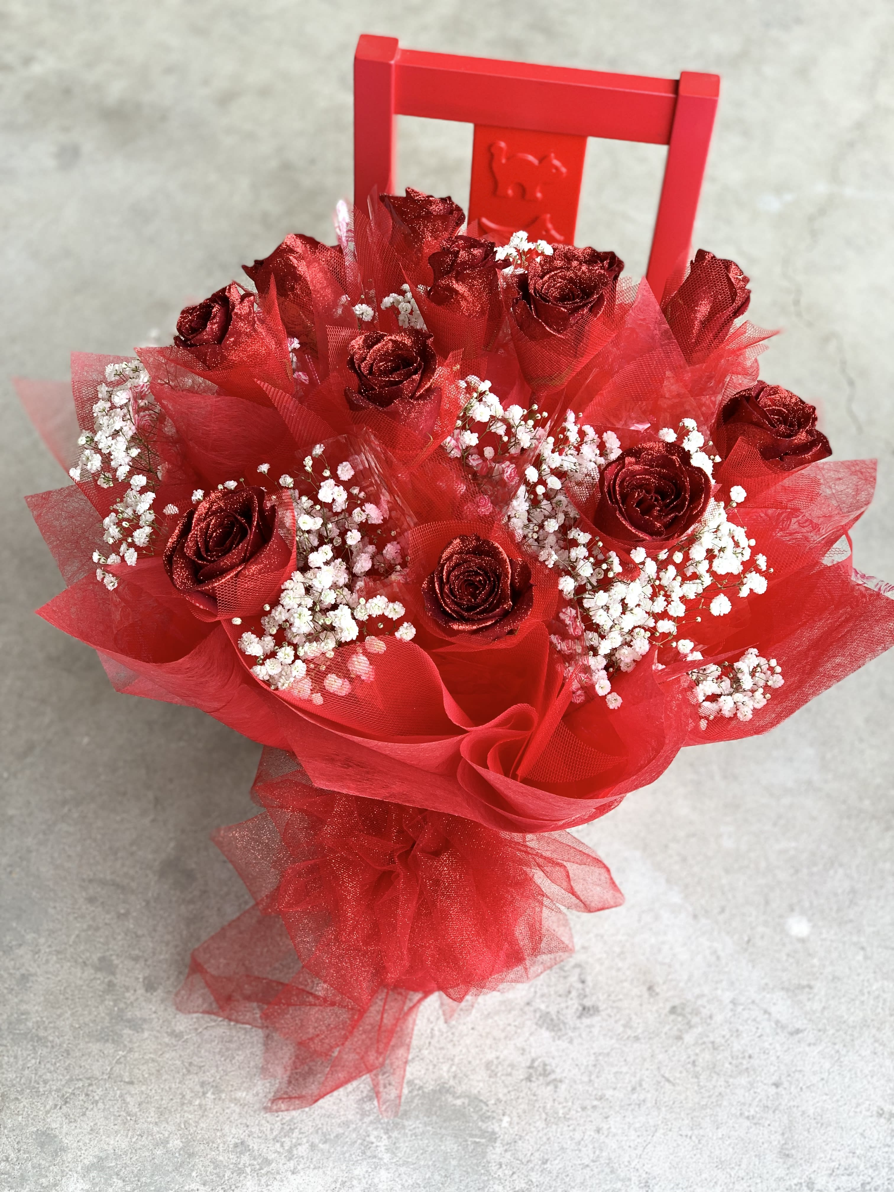 Hong Kong Style Roses - ALL Red - Hong Kong Style Red Roses with all red wrapping  1/2 Dozen $150 1 Dozen $220 2 Dozen $430 Prices above include vase.   *** GRADUATION HONG KONG STYLE ROSES, PLEASE PHONE-IN  Hong Kong Style Roses WRAPPED ( without a vase) will come with water tubes/water pouch.   Recommended for graduations!  Additional $20   