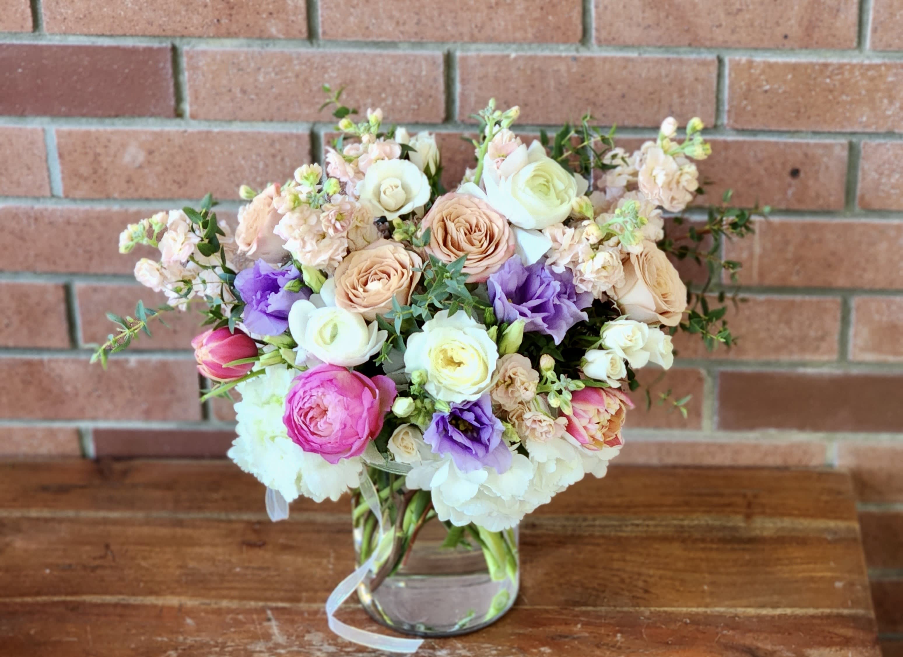 Rosette - Hydrangeas, garden roses, ranunculus, stock, lisianthus, tulips - pastel colors fragrant and lush in a clear vase with ribbons 