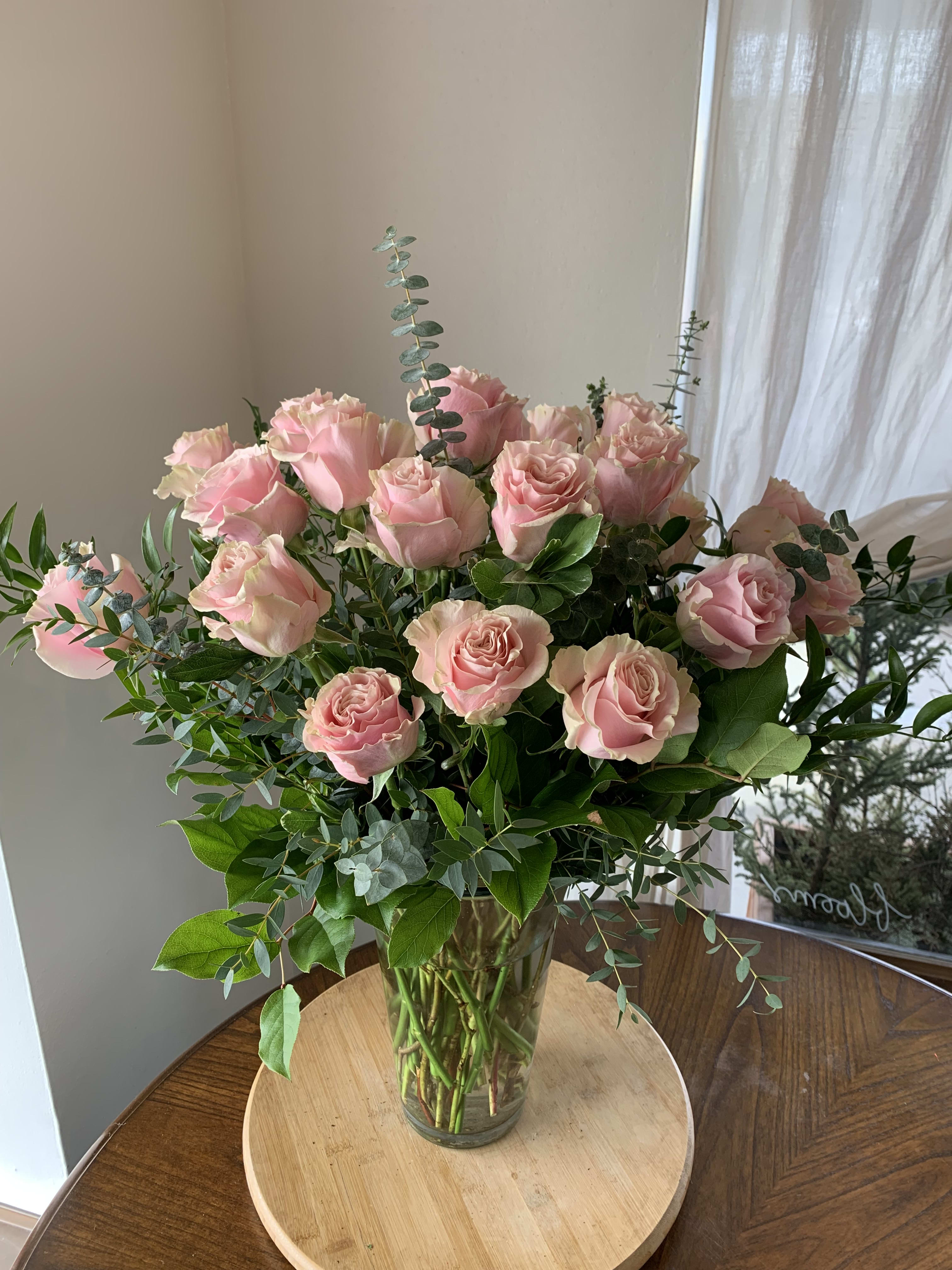 Seasonal Two Dozen Seasonal Two Dozen - A vase full of mixed greens and roses make a very classic and elegant look. *If you have a color preference please leave message in special notes.