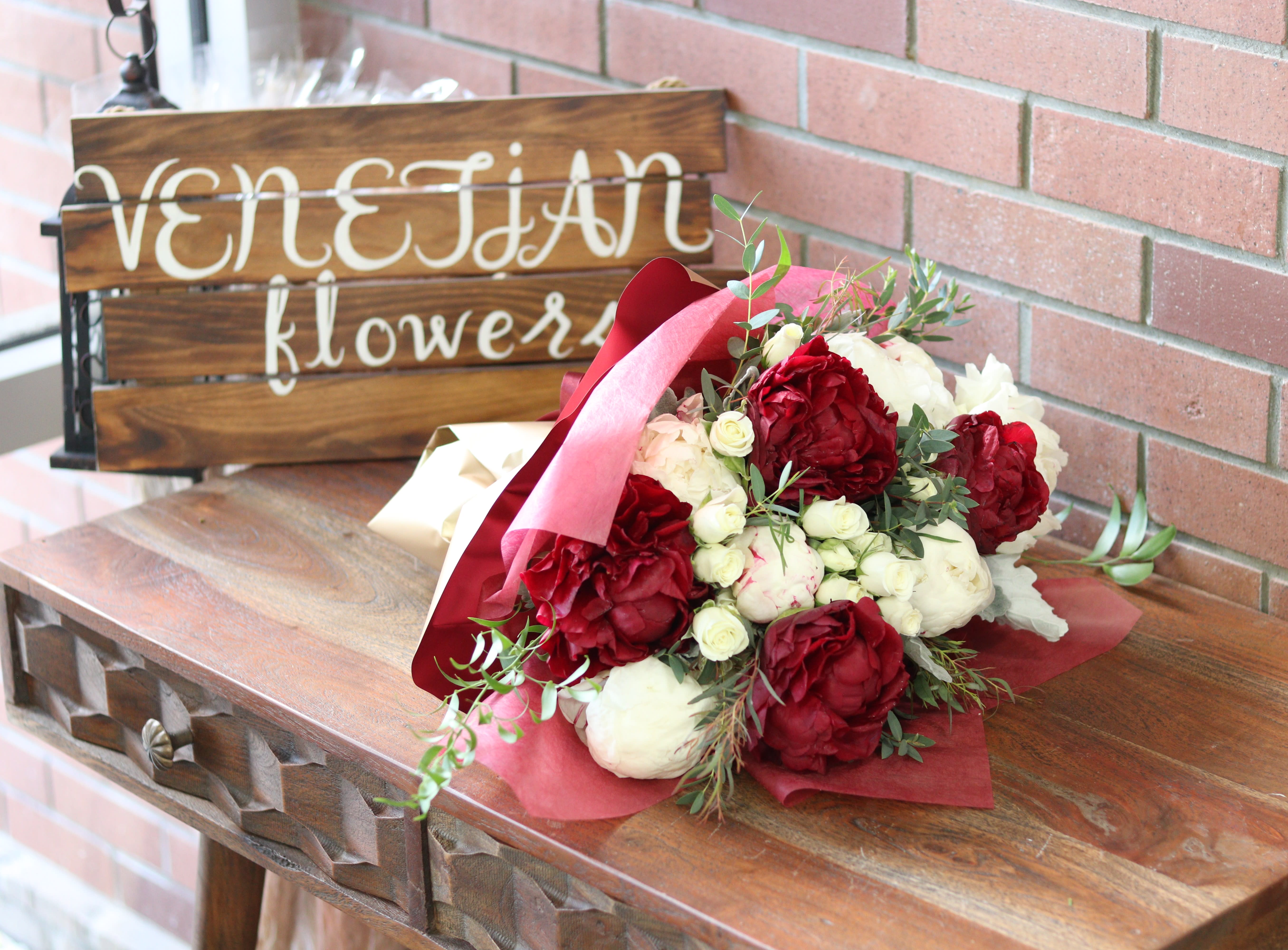Peonies &amp; Spray Roses Wrapped Bouquet - 10 Gorgeous Wrapped fresh peonies accented with eucalyptus and greenery - standard. 15 - Deluxe 20 - Premium Color may vary based on the freshest availability - Our weekly delivery usually has pink, white and red peonies 