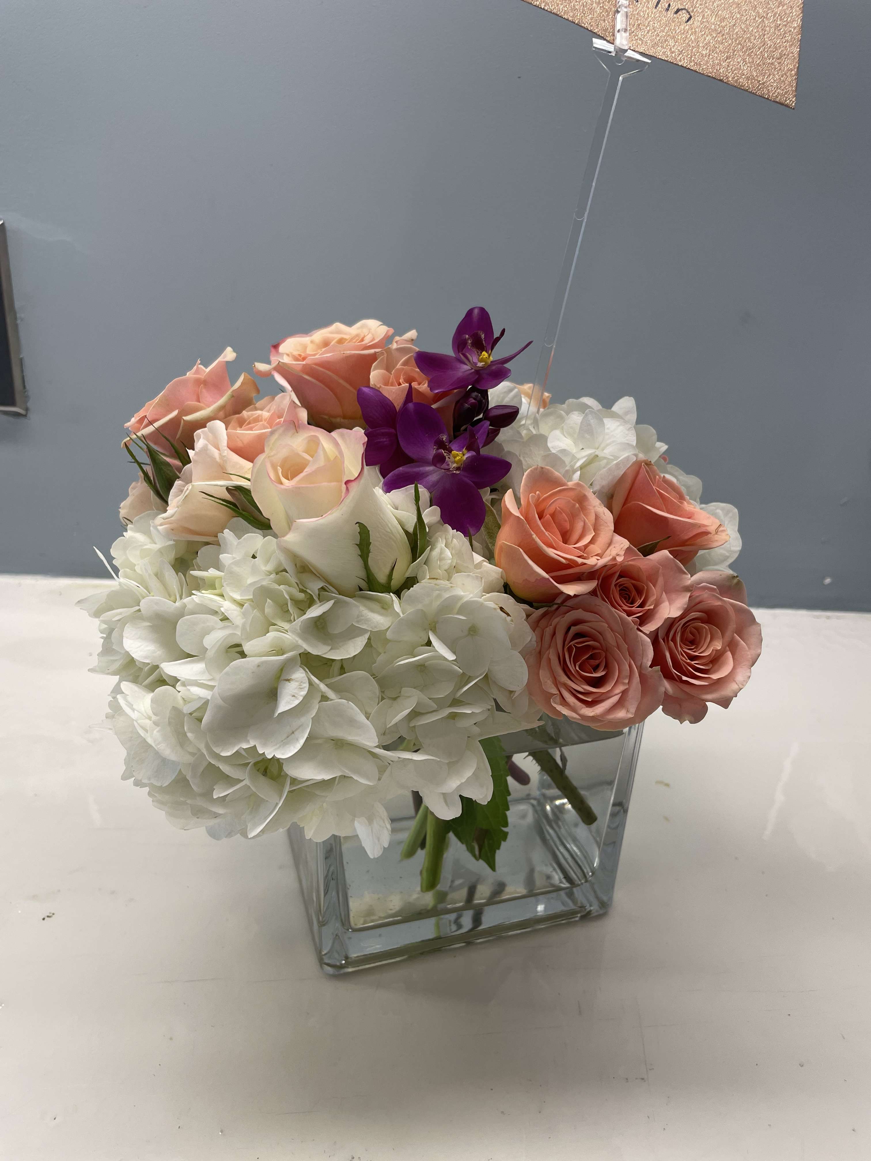 Medium square  - Our best seller in a size down. White hydrangea with colored roses and fresh stock