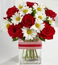 ️ "Country Charm Bouquet" ️ "Country Charm Bouquet" - Rustic Beauty with a Sweet, Heartfelt Touch The Country Charm Bouquet pairs classic red roses with cheerful white daisies, beautifully arranged in a clear square glass vase tied with a charming gingham ribbon. It’s the perfect way to send love, warmth, and a little rustic joy to someone special. Fresh, hand-arranged blooms Perfect for birthdays, anniversaries, or just because Ready-to-display — vase included! Bring a touch of countryside sweetness straight to their door!