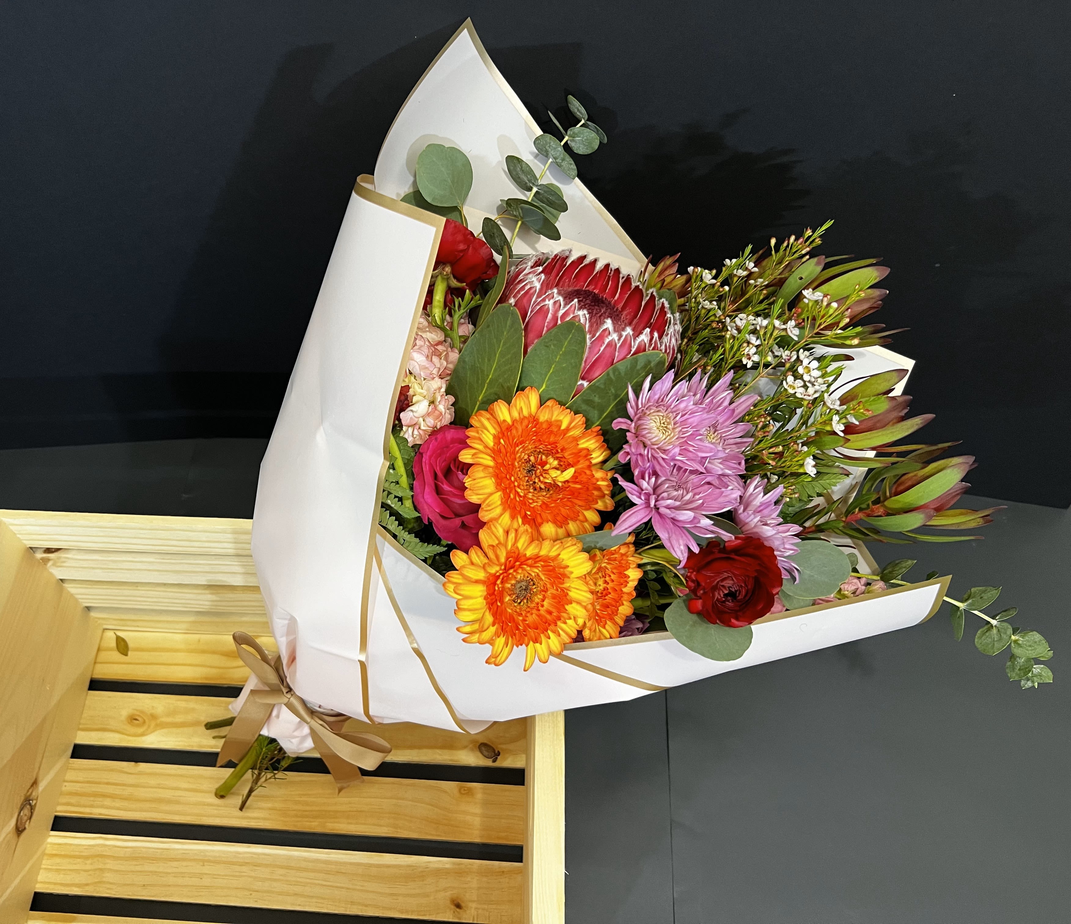 Tropical Wrapped By Ray - A wrapped bouquet using tropical flowers or customized. 