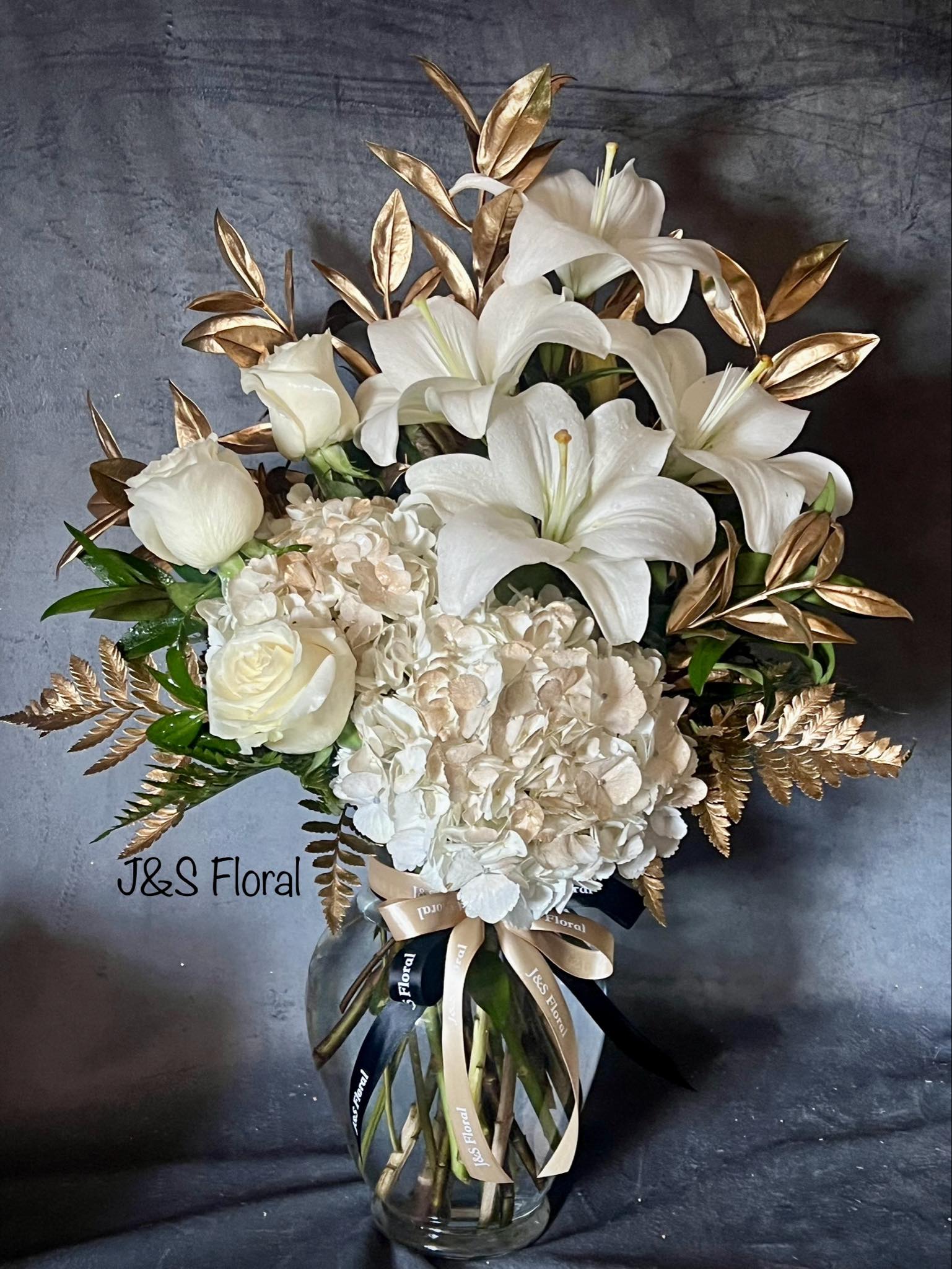 Golden Moments - Introducing our new design Golden Moments, beautifully arranged with Golden Hydrangeas, Roses, White Lilies and golden greenery. 