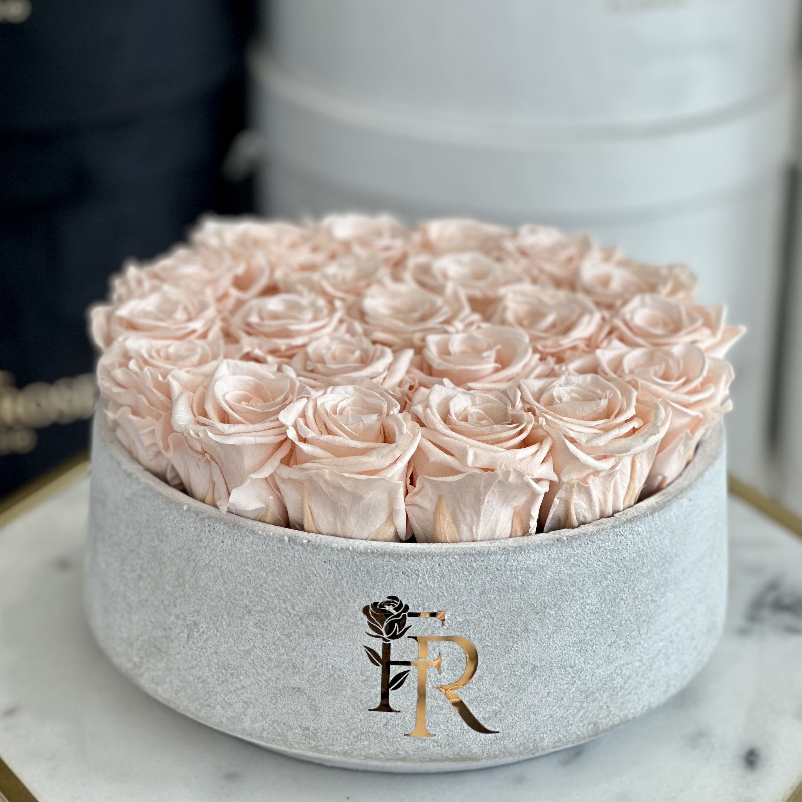 Maggie (Eternal Roses) - Light peach preserved roses in our flat vase , beautiful gift and design add on.   Approx. 22 roses