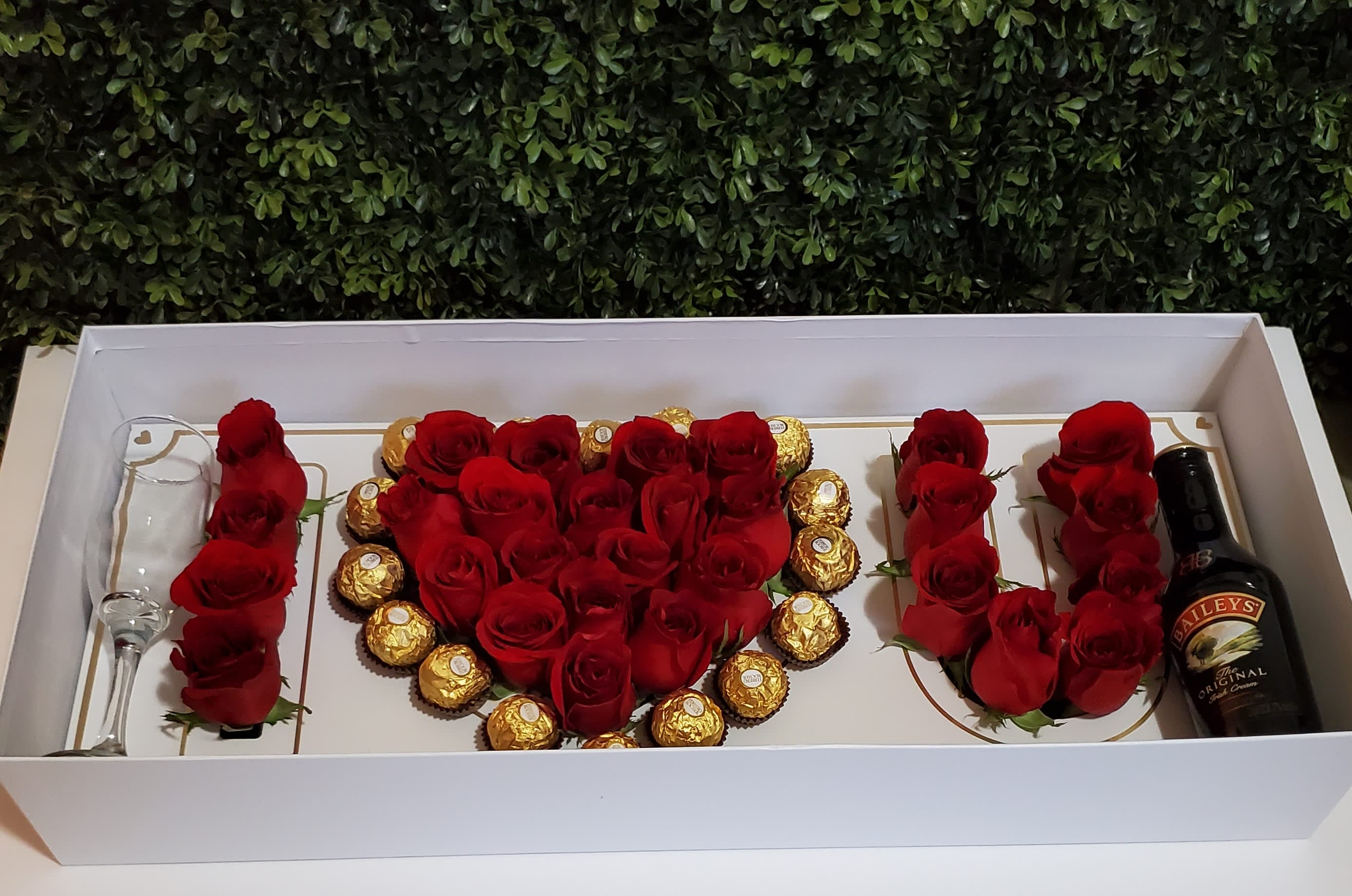 I Heart You - Say no more with this luxury box. &quot;I LOVE YOU&quot; filled with fresh roses, chocolate and accented butterflies. Please note, the wine glass and alcohol are not included. 