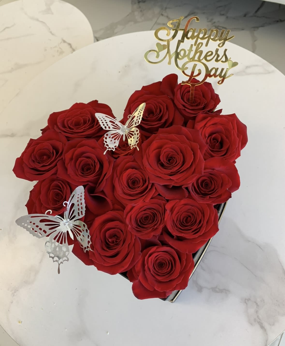 Mother’s Day rose heart box  - Our rose heart box elegantly arranged with red roses and our golden Mother’s Day sign . Roses color available in pink , red, or white. You may select your single color upon ordering.