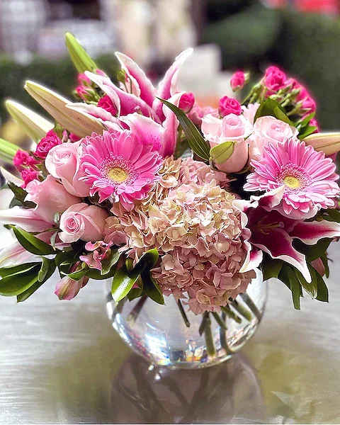 Pink Opal - Part of Adelaide's new custom &quot;Jewel Collection&quot; this gorgeous mix of pink roses, hydrangea, stargazer lilies, and other seasonal flowers and greens is perfect for anyone who loves the color pink. Some of the flowers in this collection may change seasonally, but our designers always choose the best of the best and will ensure that the style, color and value are always the same or better.  All prices in USD ($)