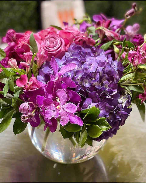 Purple Sapphire - Part of our new Jewel Collection, Purple Sapphire is perfect anyone royal in your life, including you! A mix of Mokara Orchids, Roses, Hydrangea and other seasonal flowers and greens will make the Queen or King in your life smile! Our buyer selects the best flowers for this collection so the type of flowers may change seasonally, but the value, design and overall beauty remains the same!  All prices in USD ($)