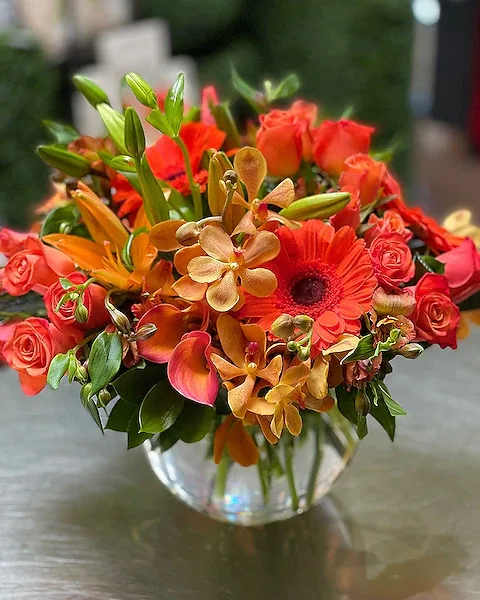 Orange Topaz - Part of our new Jewel Collection, Orange Topaz is perfect anyone who shines bright in your life! A mix of Mokara Orchids, Asiatic Lilies Roses, Gerberas, and other seasonal flowers and greens will complement both home and office! Our buyer selects the best flowers for this collection so the type of flowers may change seasonally, but the value, design and overall beauty remains the same!  All prices in USD ($)